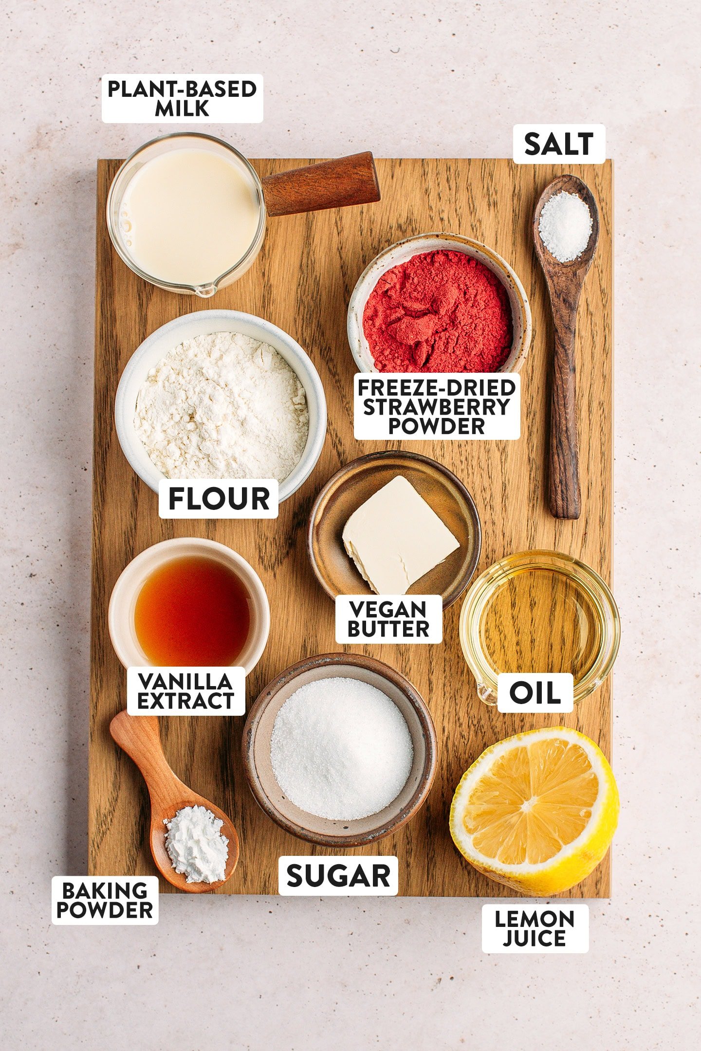 Ingredients like freeze-dried strawberry powder, flour, sugar, butter, and vanilla extract.