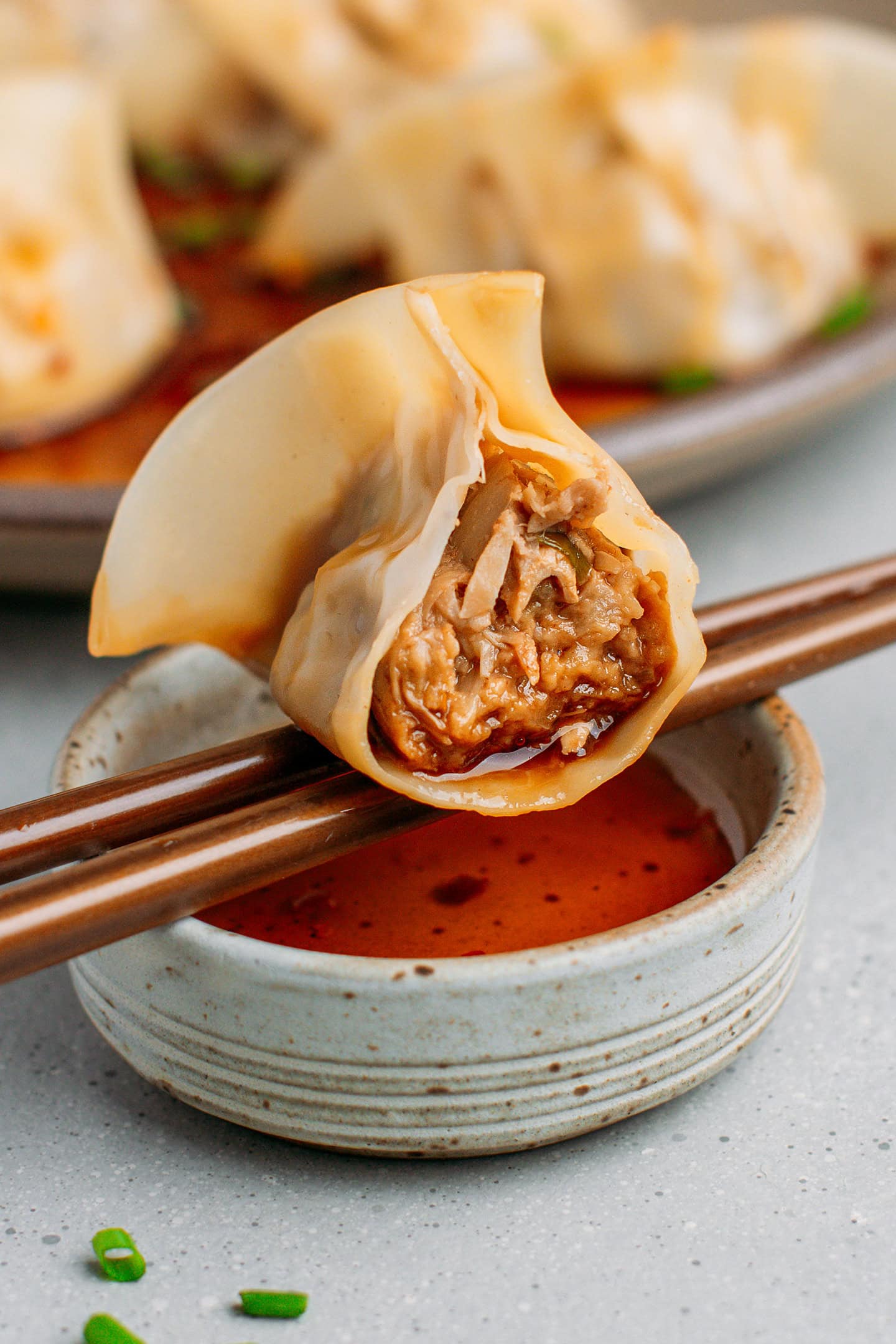 Bite of a dumpling showing the juicy jackfruit filling inside.