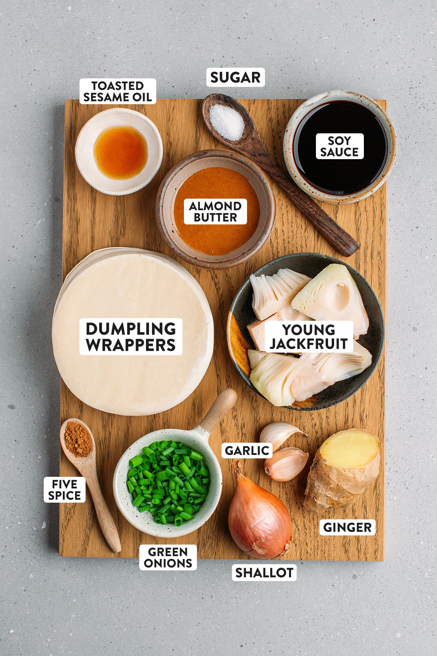 Ingredients like young green jackfruit, dumpling wrappers, soy sauce, garlic, and ginger.