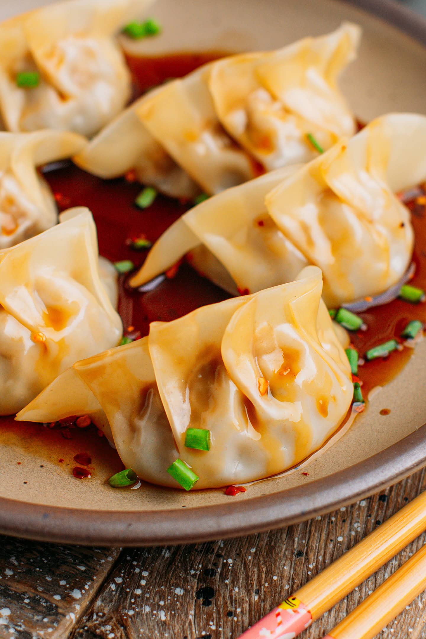 Close-up of a cooked jackfruit dumpling on a brown plate.