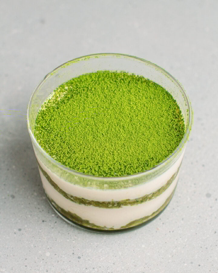 Matcha tiramisu in a small ramekin.