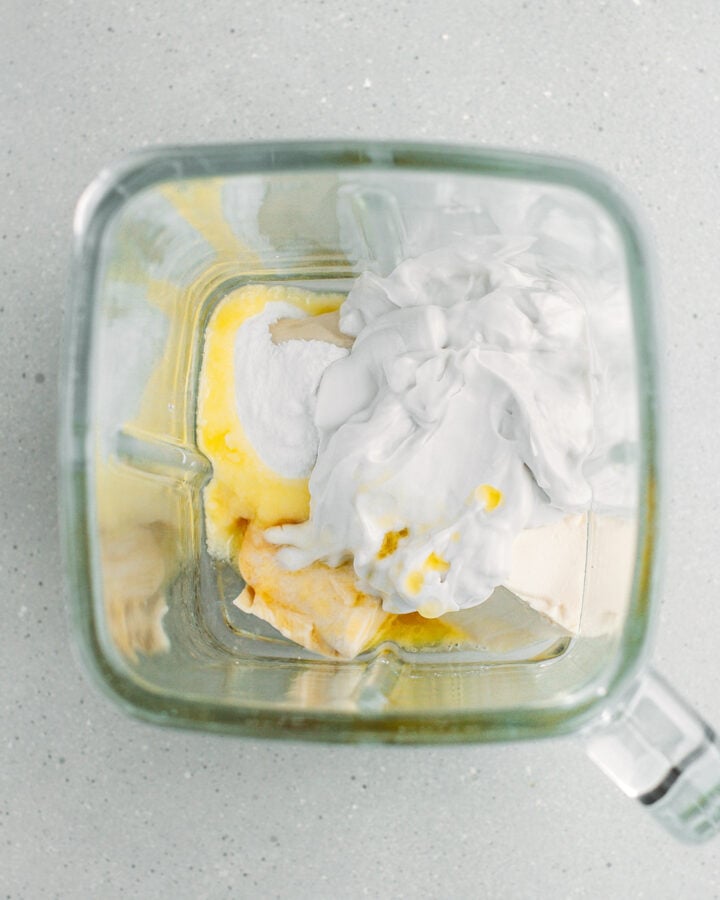 Firm silken tofu, coconut cream, and melted butter in a blender.