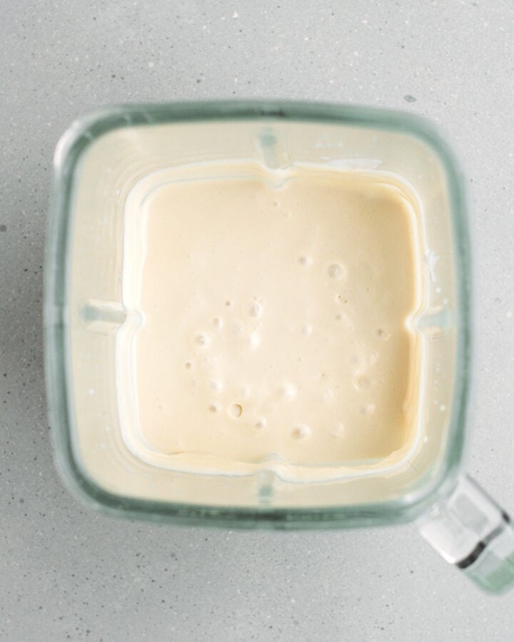 Blended silken tofu and coconut cream in a blender.