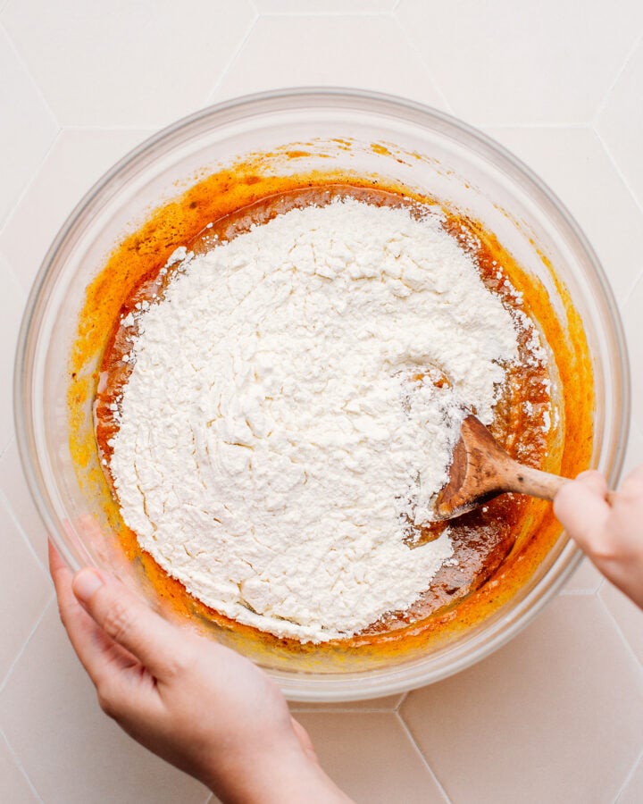 Mixing pumpkin purée and spices with flour.