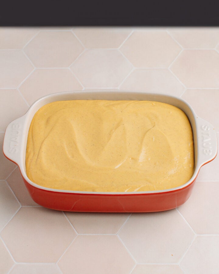 Pumpkin tiramisu inside a baking dish.