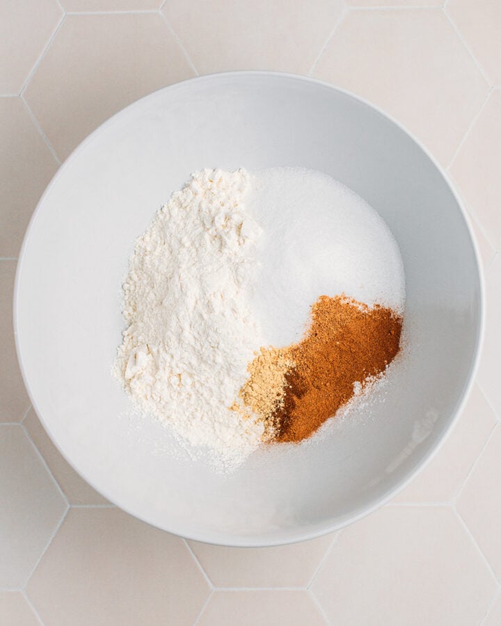 Flour, sugar, and spices in a mixing bowl.
