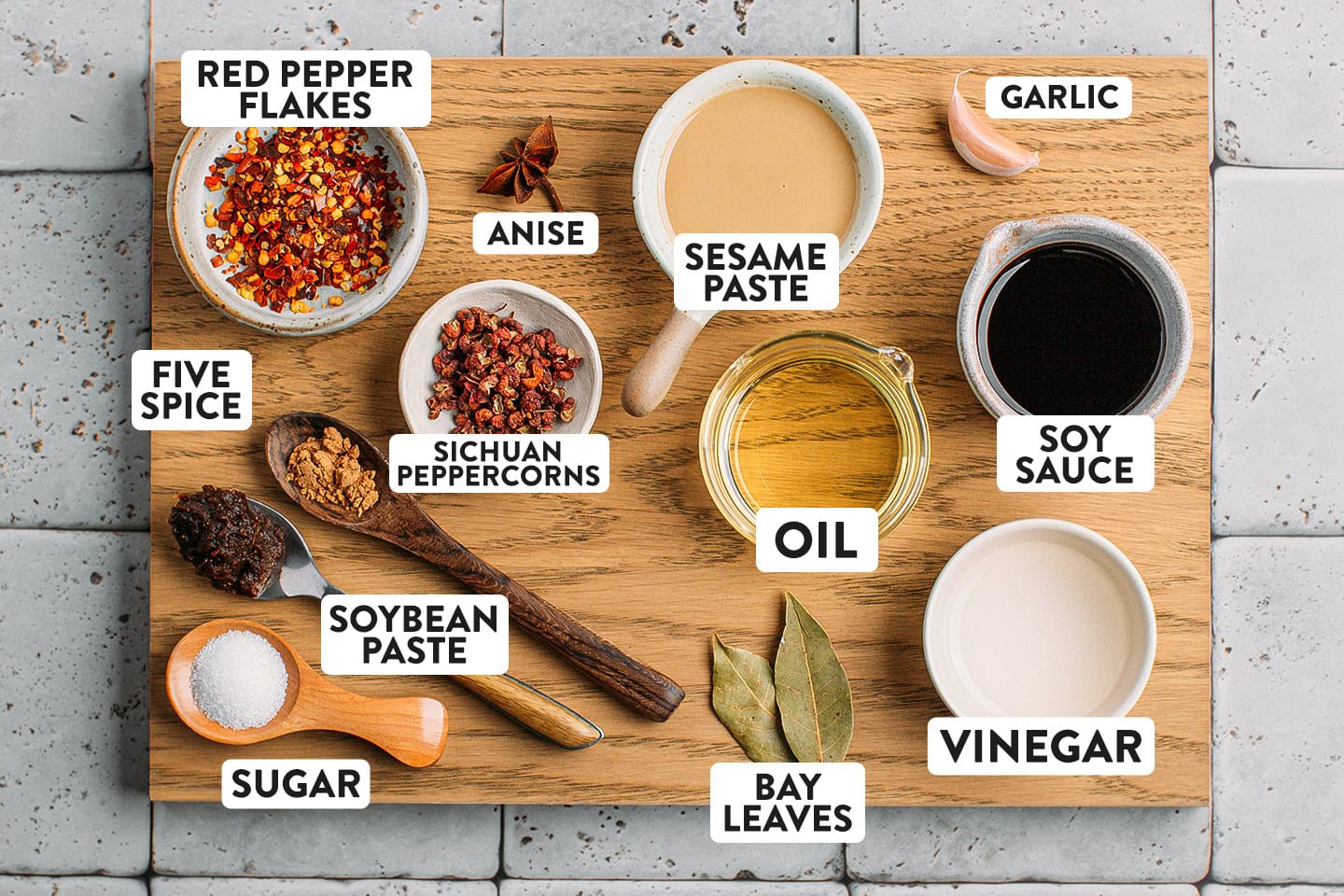 Ingredients like oil, sesame paste, Sichuan peppercorns, sugar, and garlic.