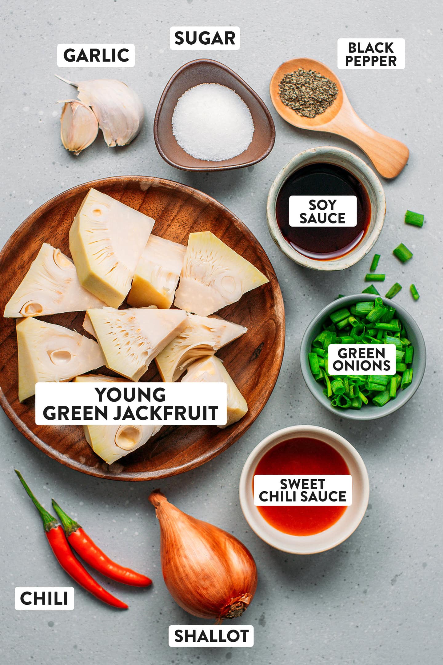 Ingredients like young green jackfruit, soy sauce, garlic, and sugar.