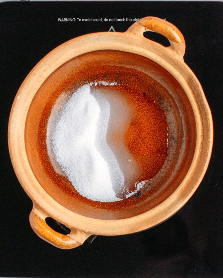 Sugar and water in a clay pot.
