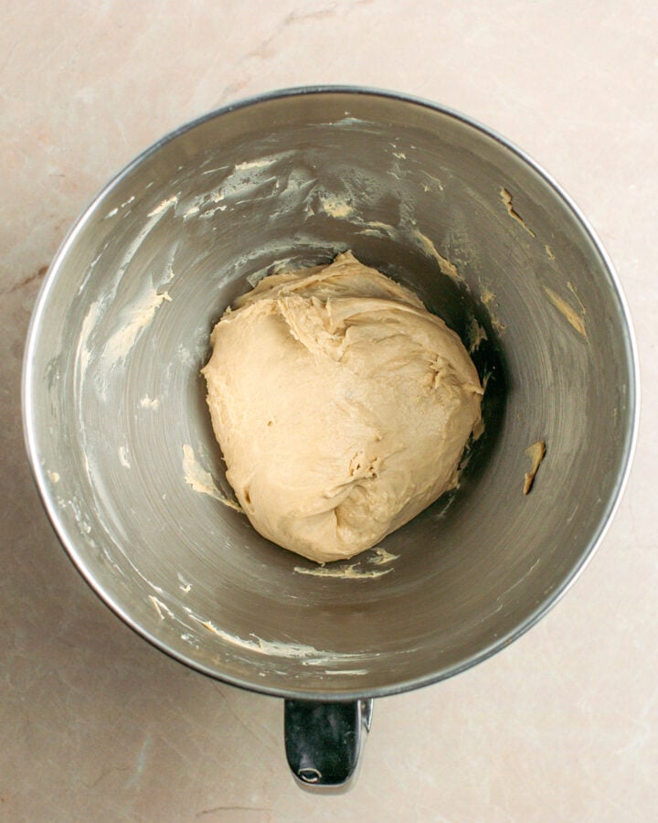 Brioche dough in a stand mixer bowl.