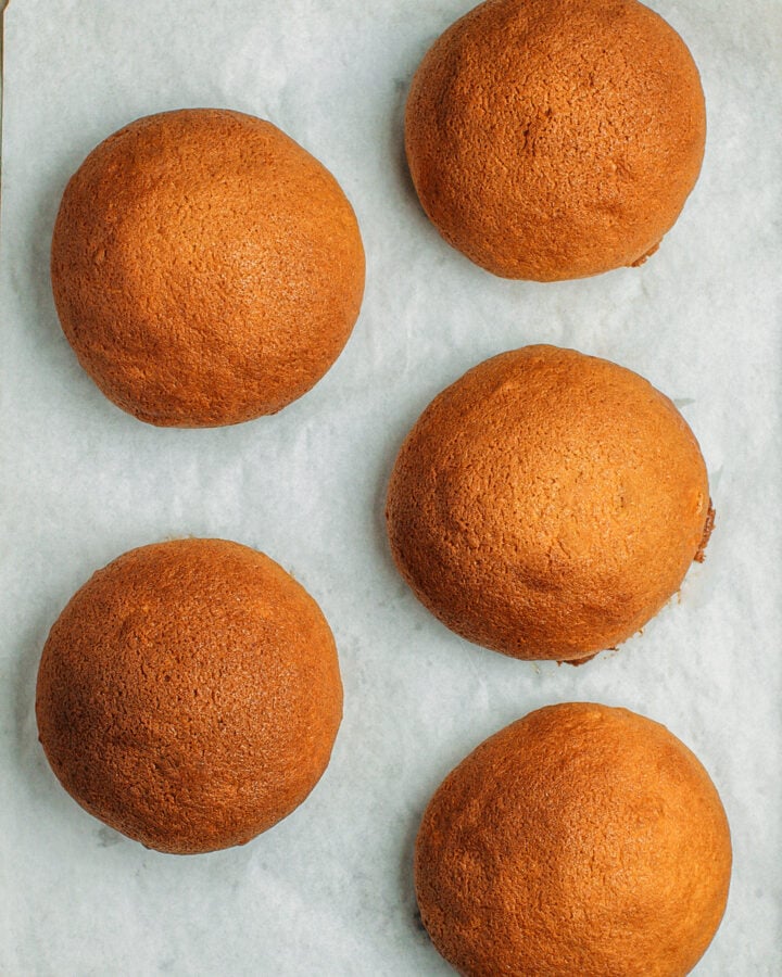 Five baked papparoti on a baking sheet.