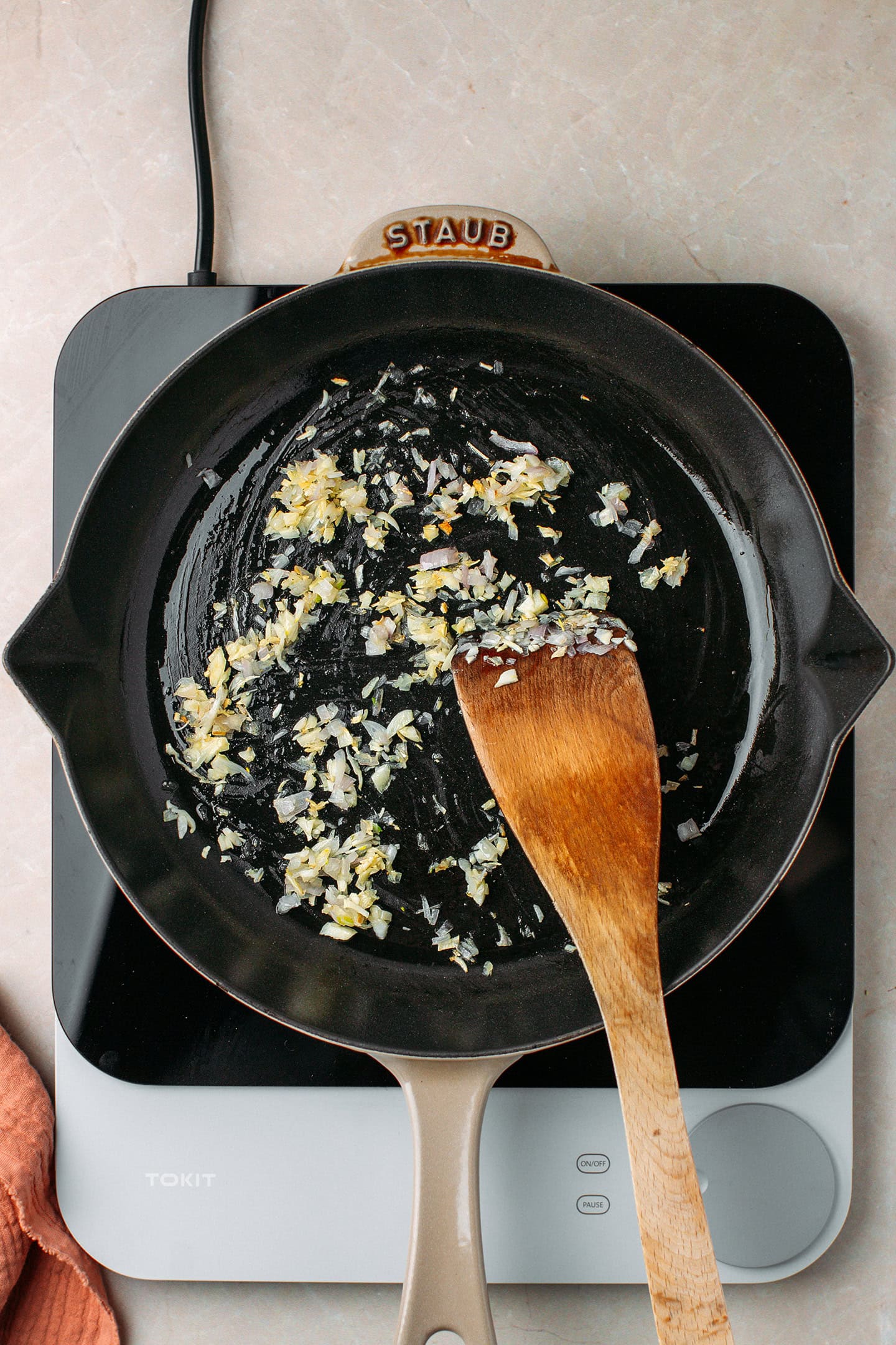 Sautéed garlic and shallot in a skillet.