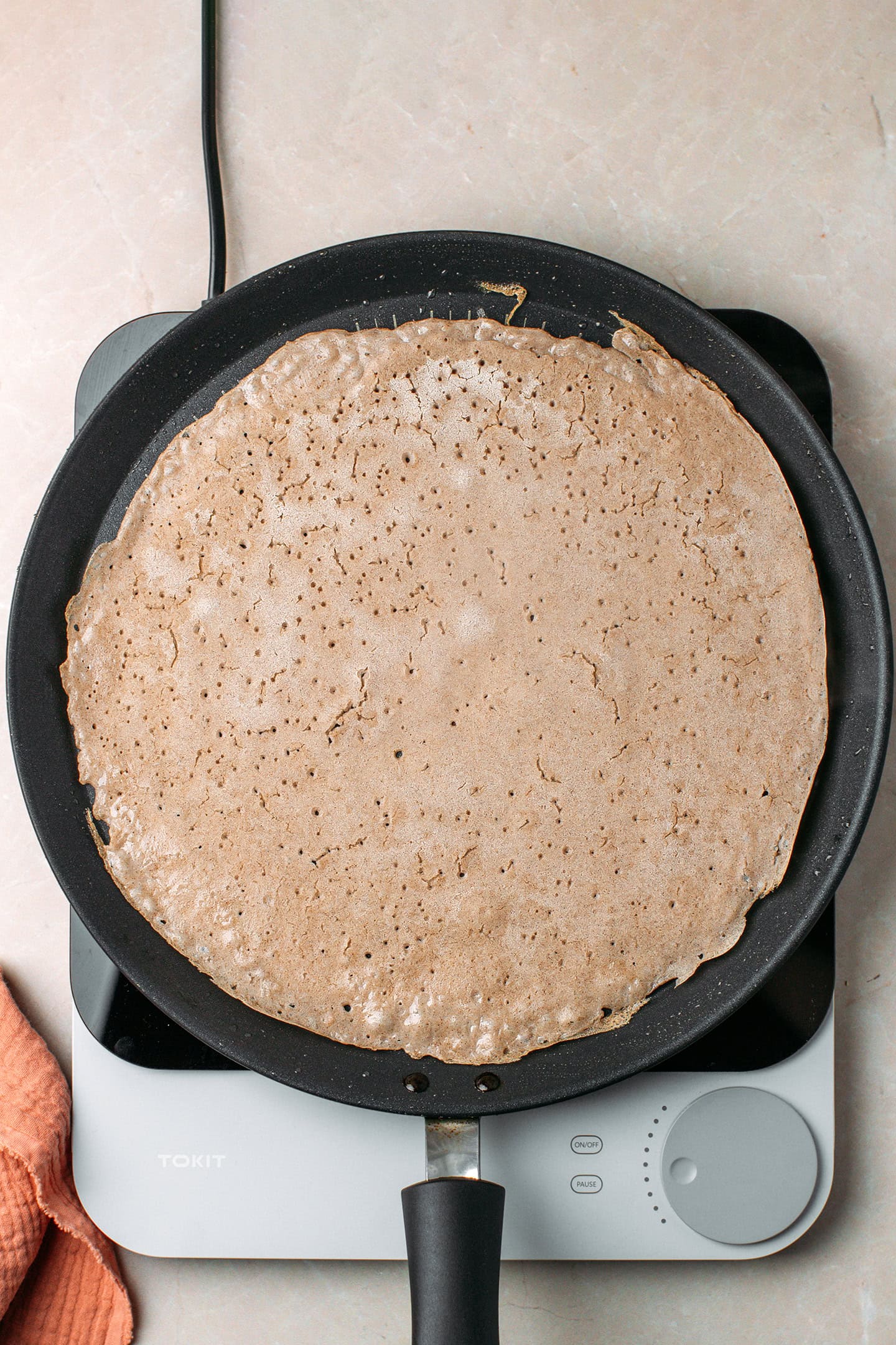 Cooked buckwheat crêpe in a non-stick skillet.