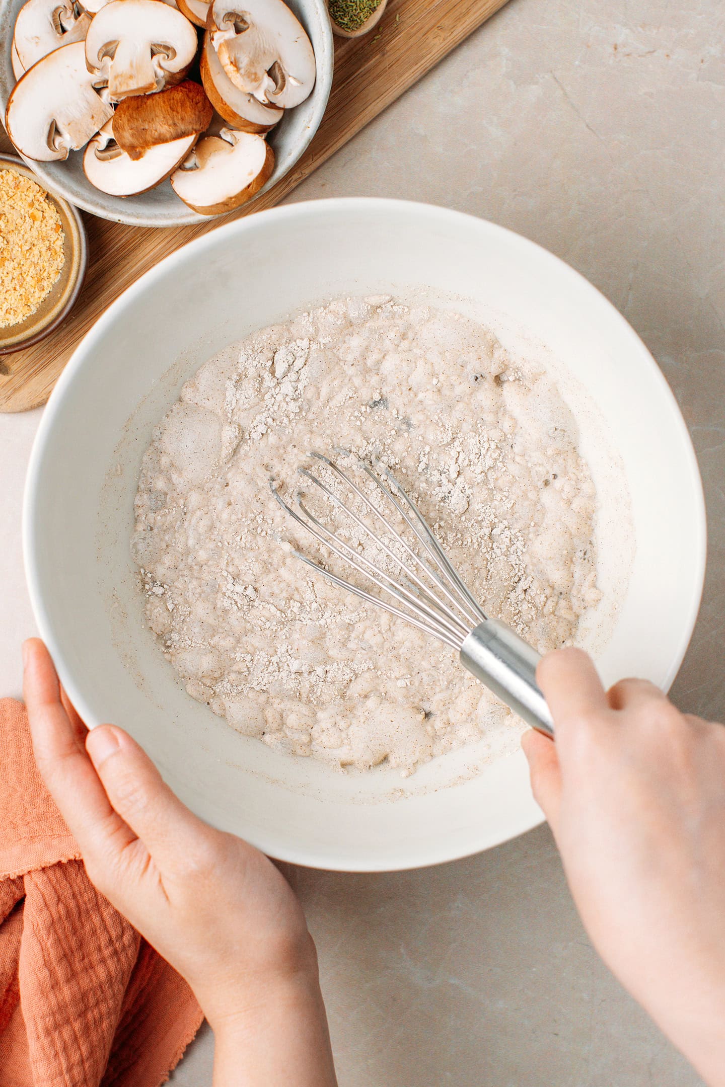 Whisking buckwheat flour, salt, and water in a bowl.