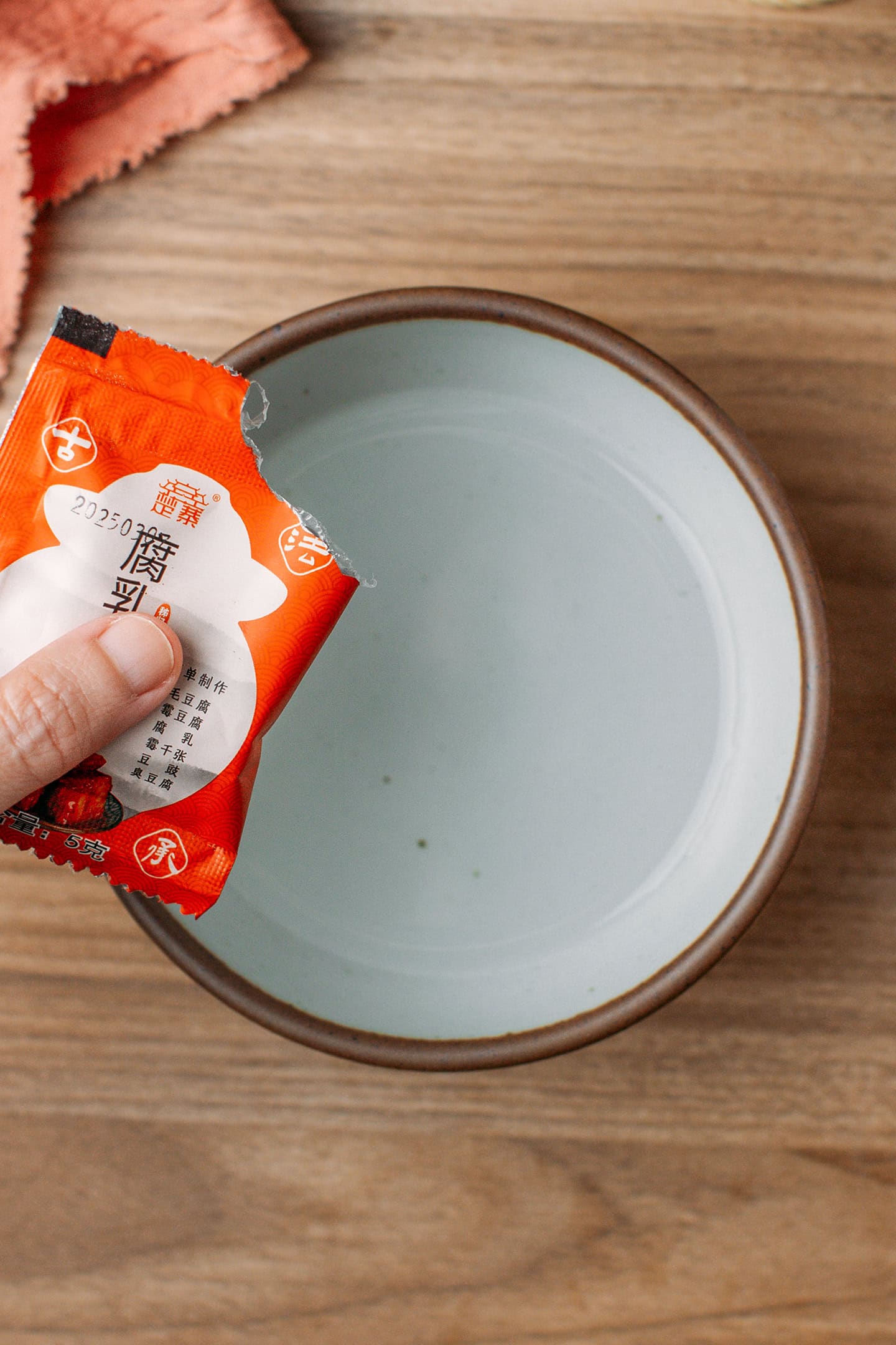 Pouring the starter into a bowl of water.