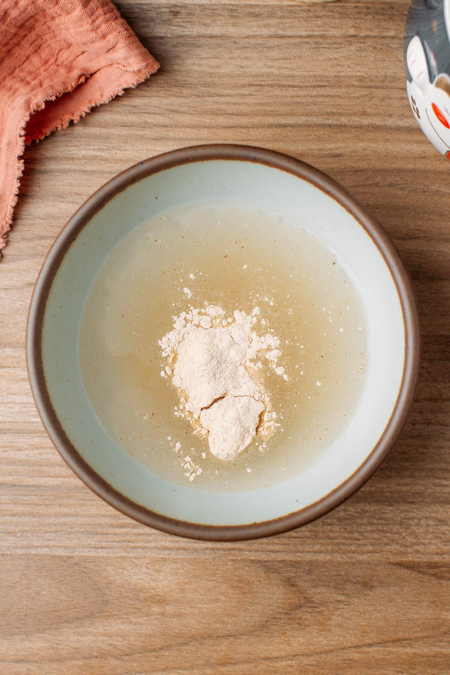 Water and stinky tofu starter in a bowl.