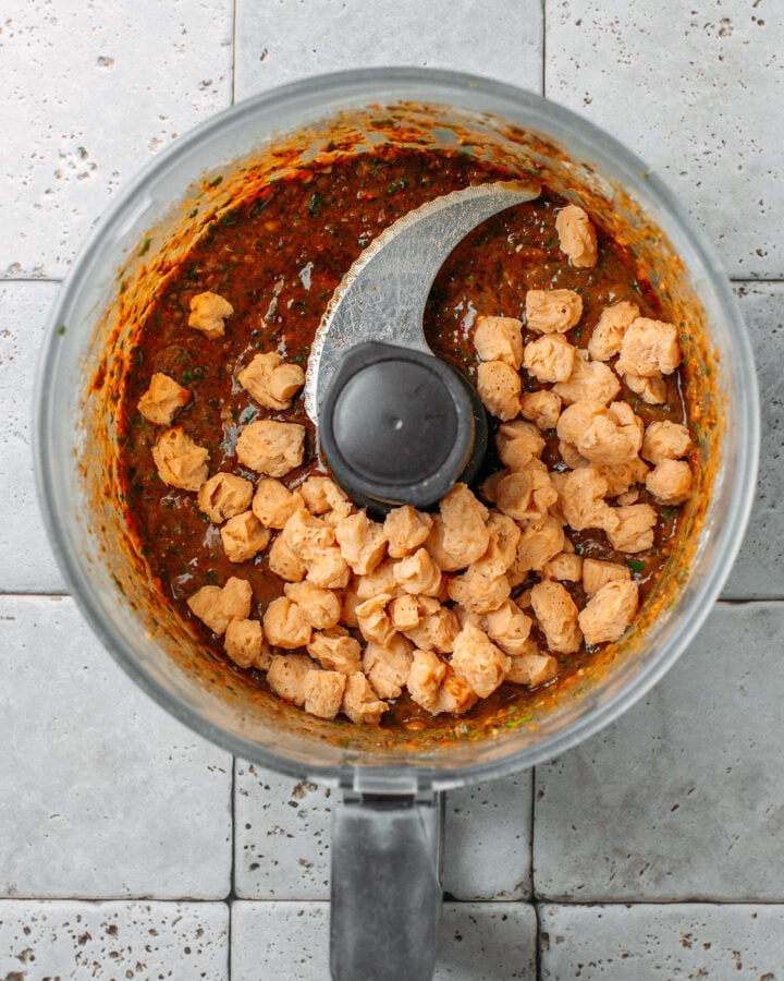 Processed beans and rehydrated TVP chunks in a food processor.