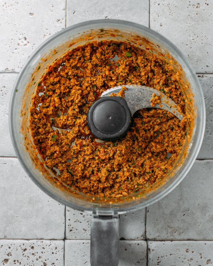 Vegan meatball mixture in a food processor.
