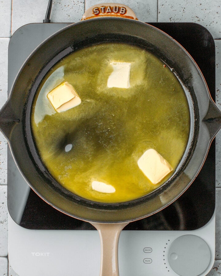 Butter melting in a skillet.