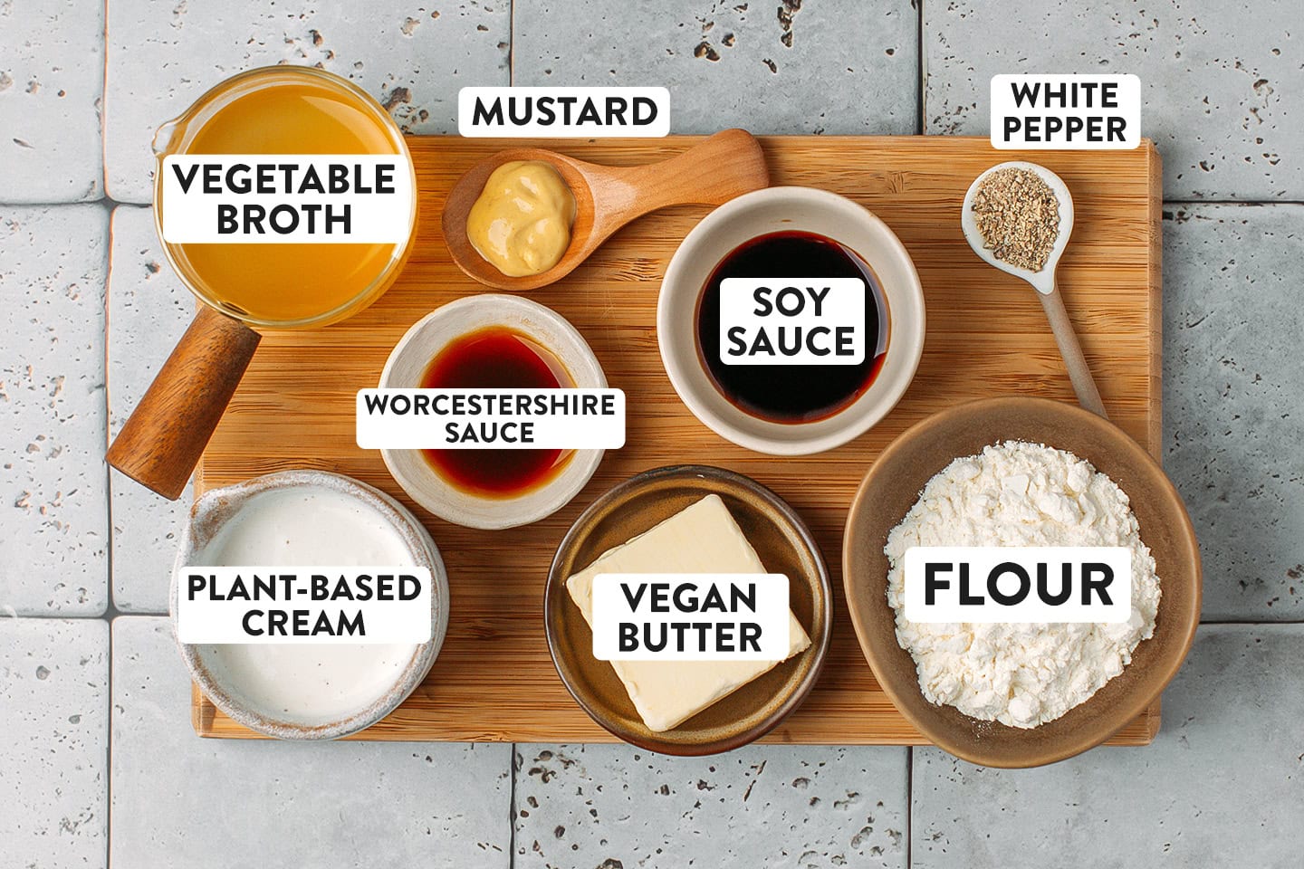 Ingredients like vegetable broth, flour, vegan butter, plant-based cream, and mustard.
