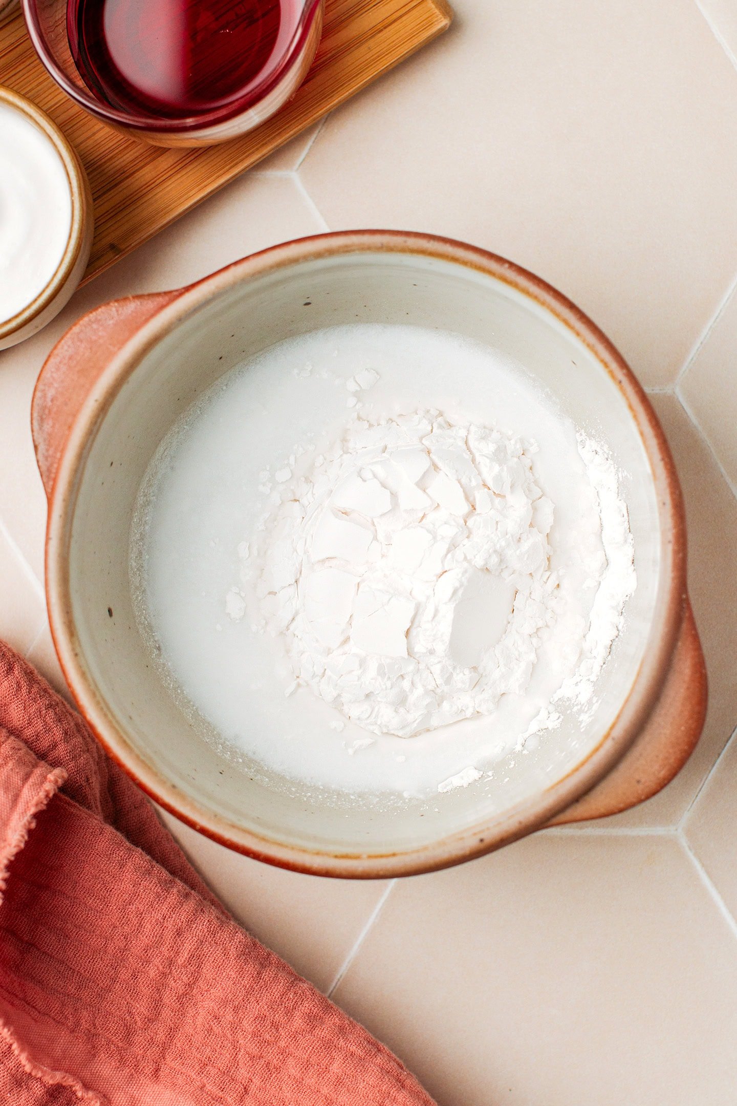 Small bowl filled with tapioca starch, rice flour, and coconut milk.