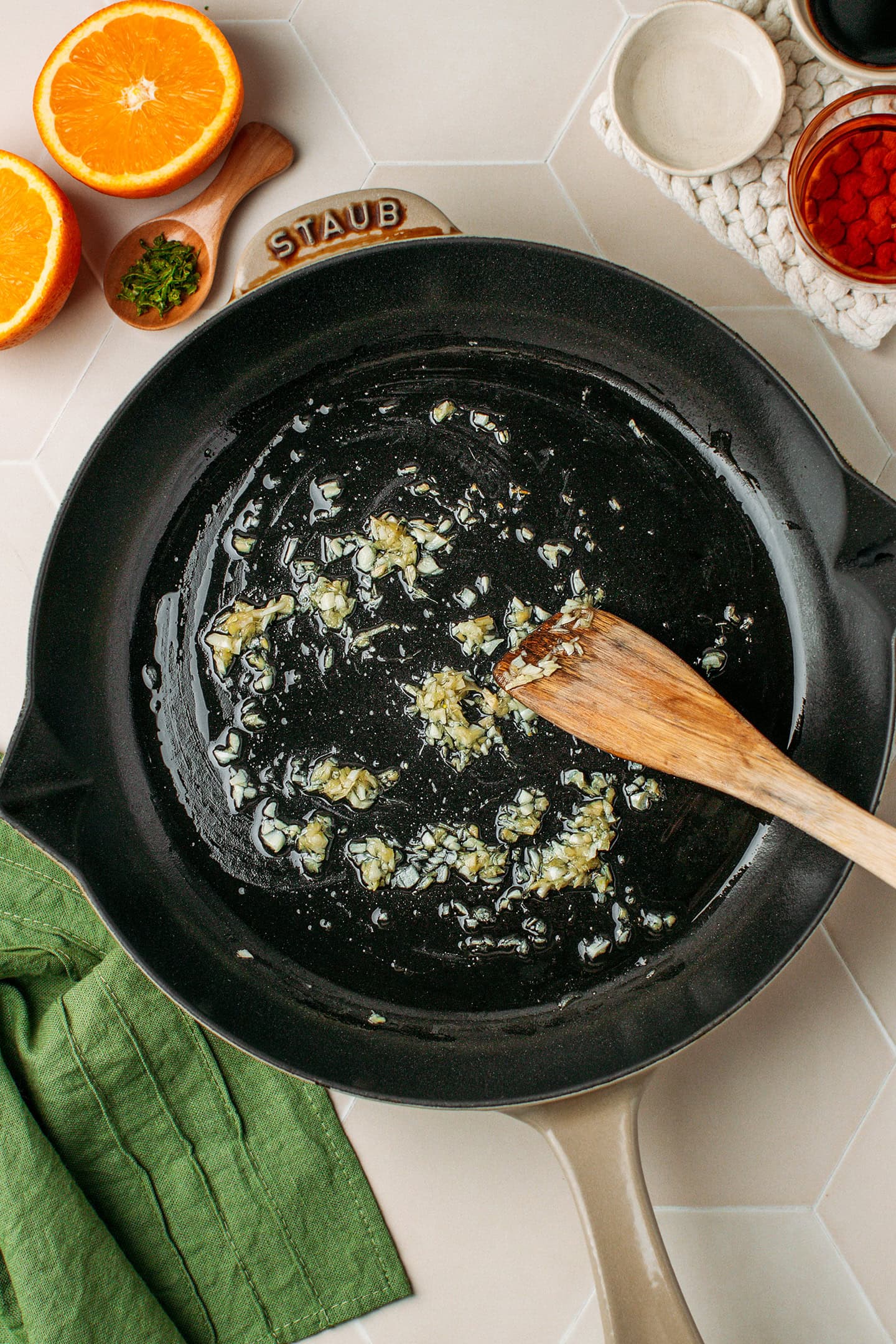 Saut&eacute;ed minced garlic and ginger in a skillet.