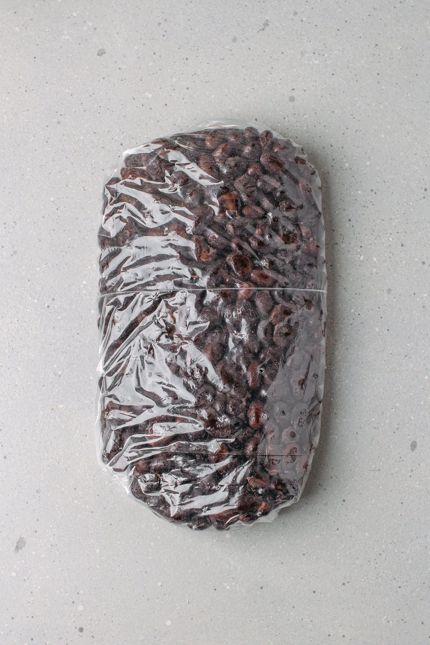 Freezer bag filled with cooked black beans.