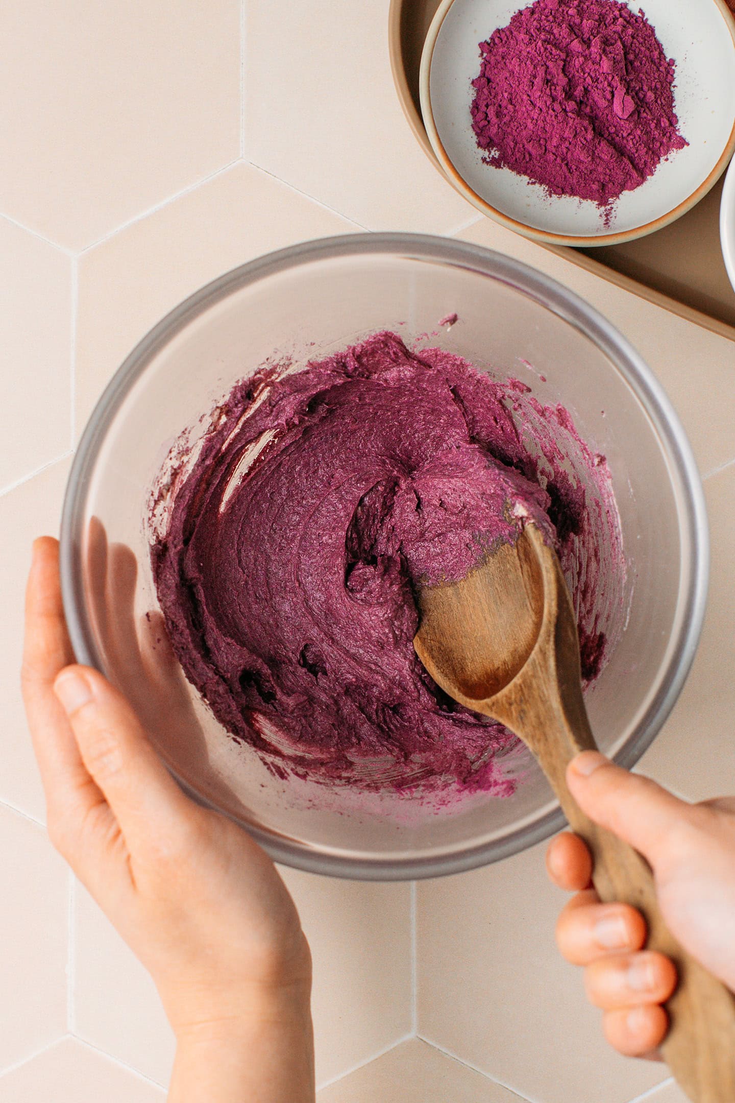 Mixing butter with ube powder.