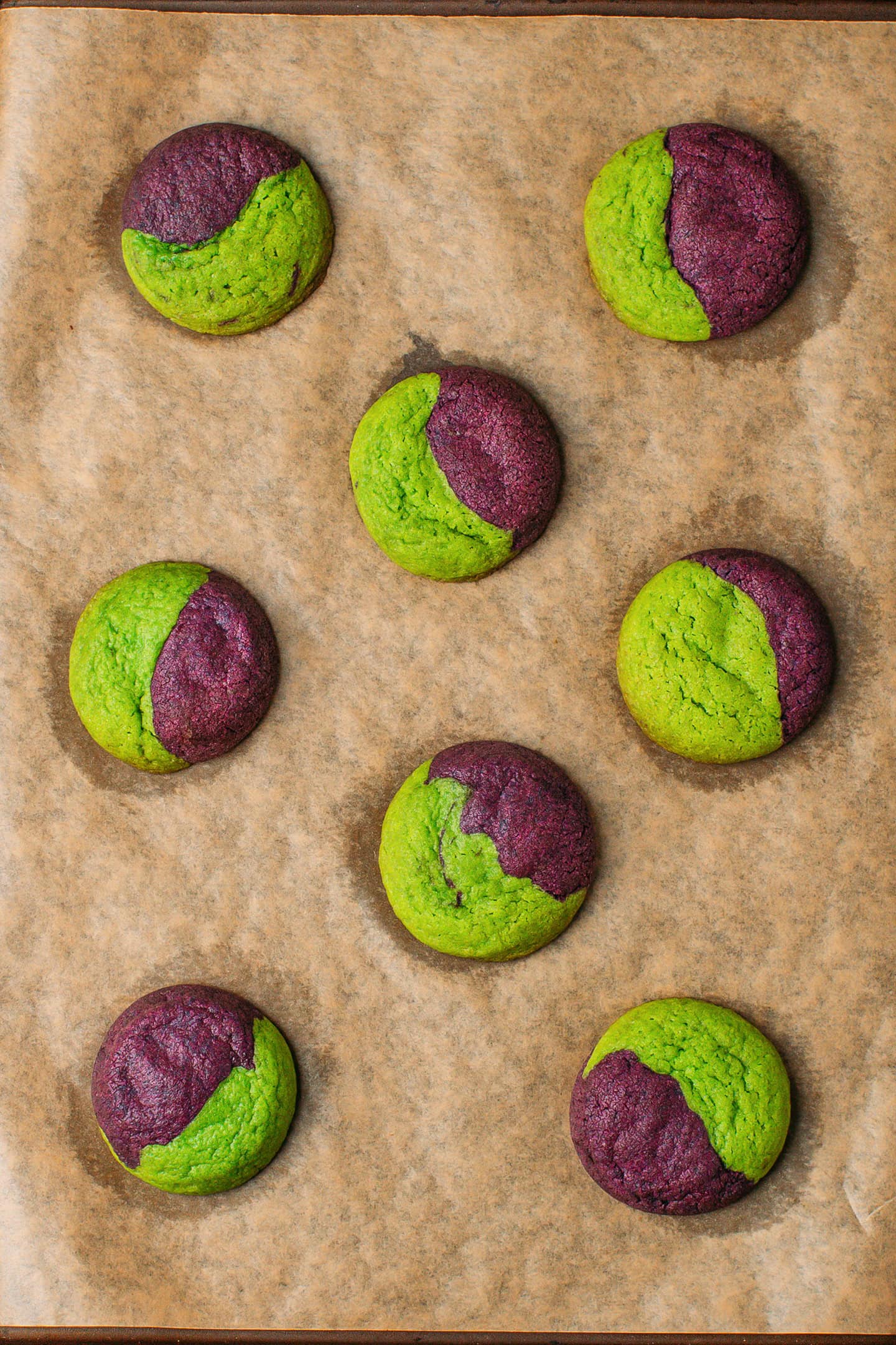 Baked ube pandan cookies on a baking sheet.