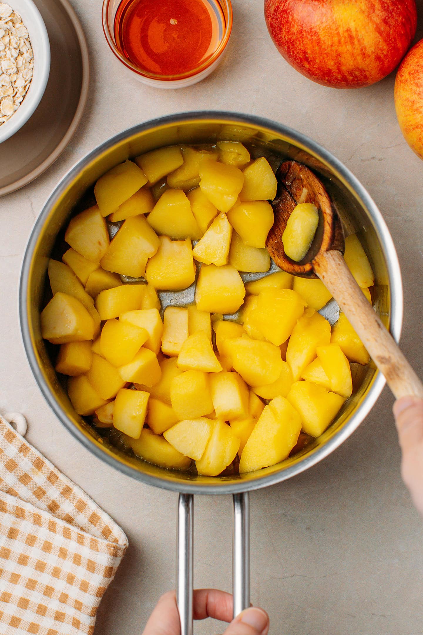 Saut&eacute;ed apples in a saucepan.
