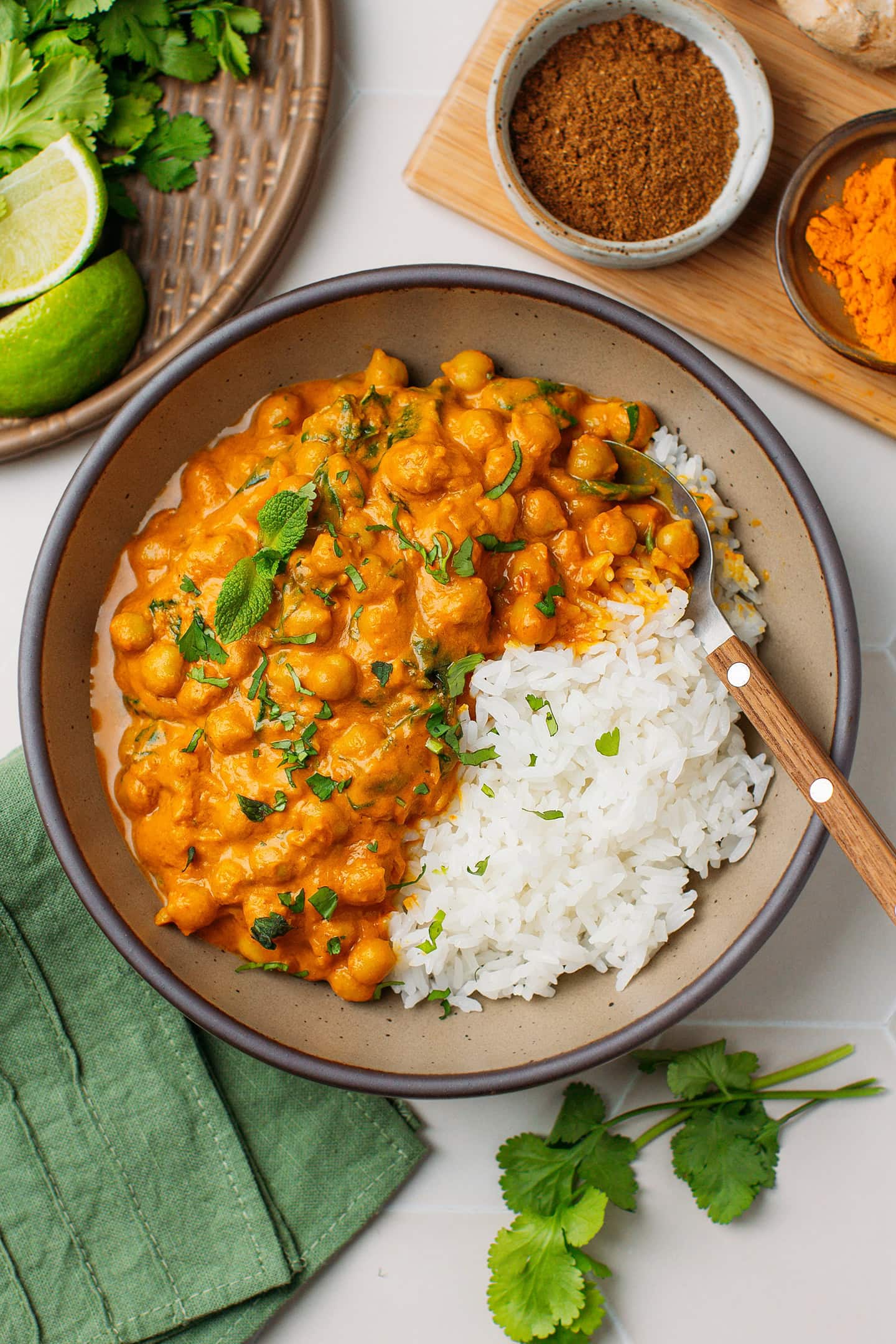 Deep bowl filled with chickpea curry and rice.