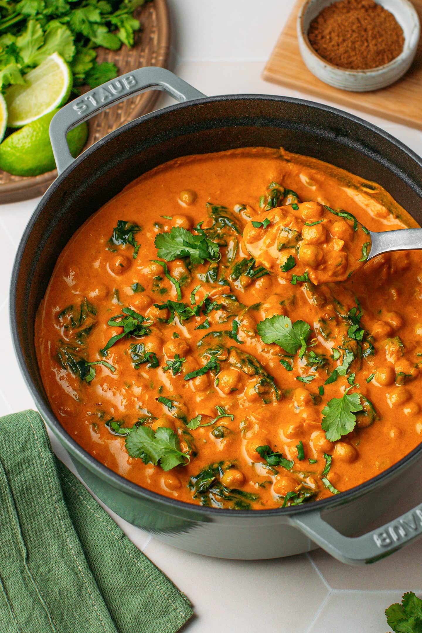 Creamy chickpea curry with spinach in a large Dutch oven.