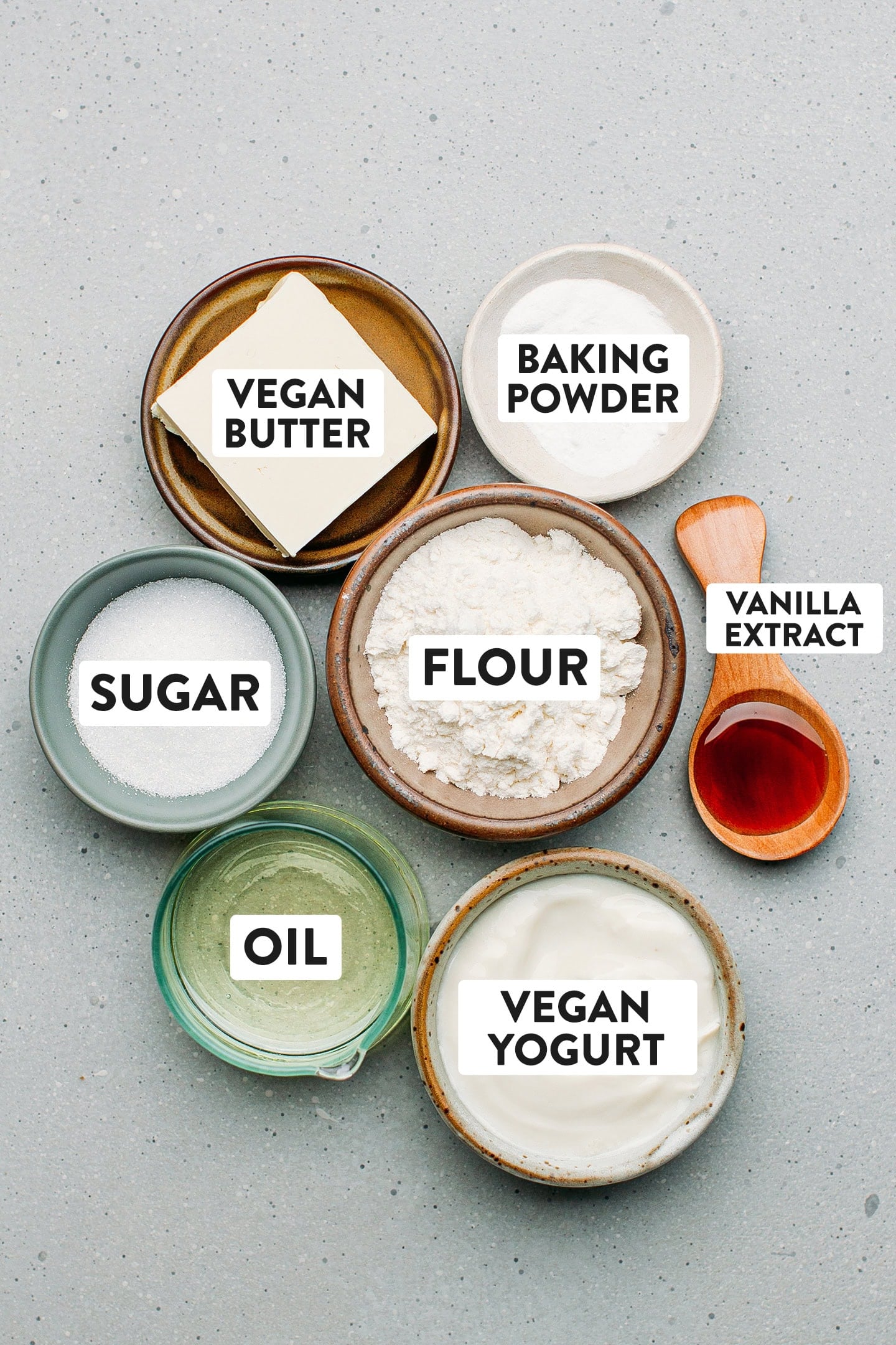 Ingredients like flour, butter, yogurt, oil, and sugar.