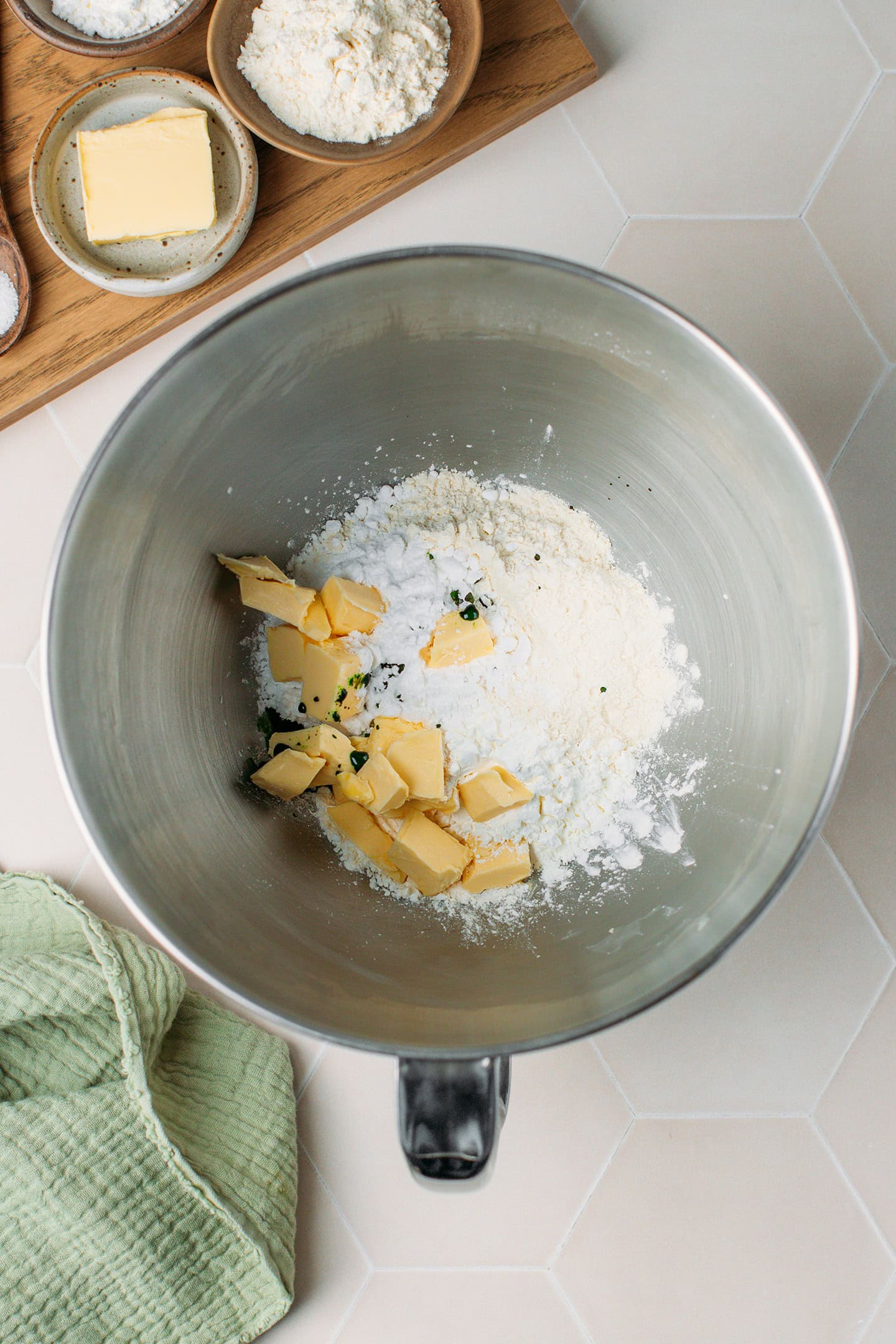 Flour, powdered sugar, and butter in a stand mixer.