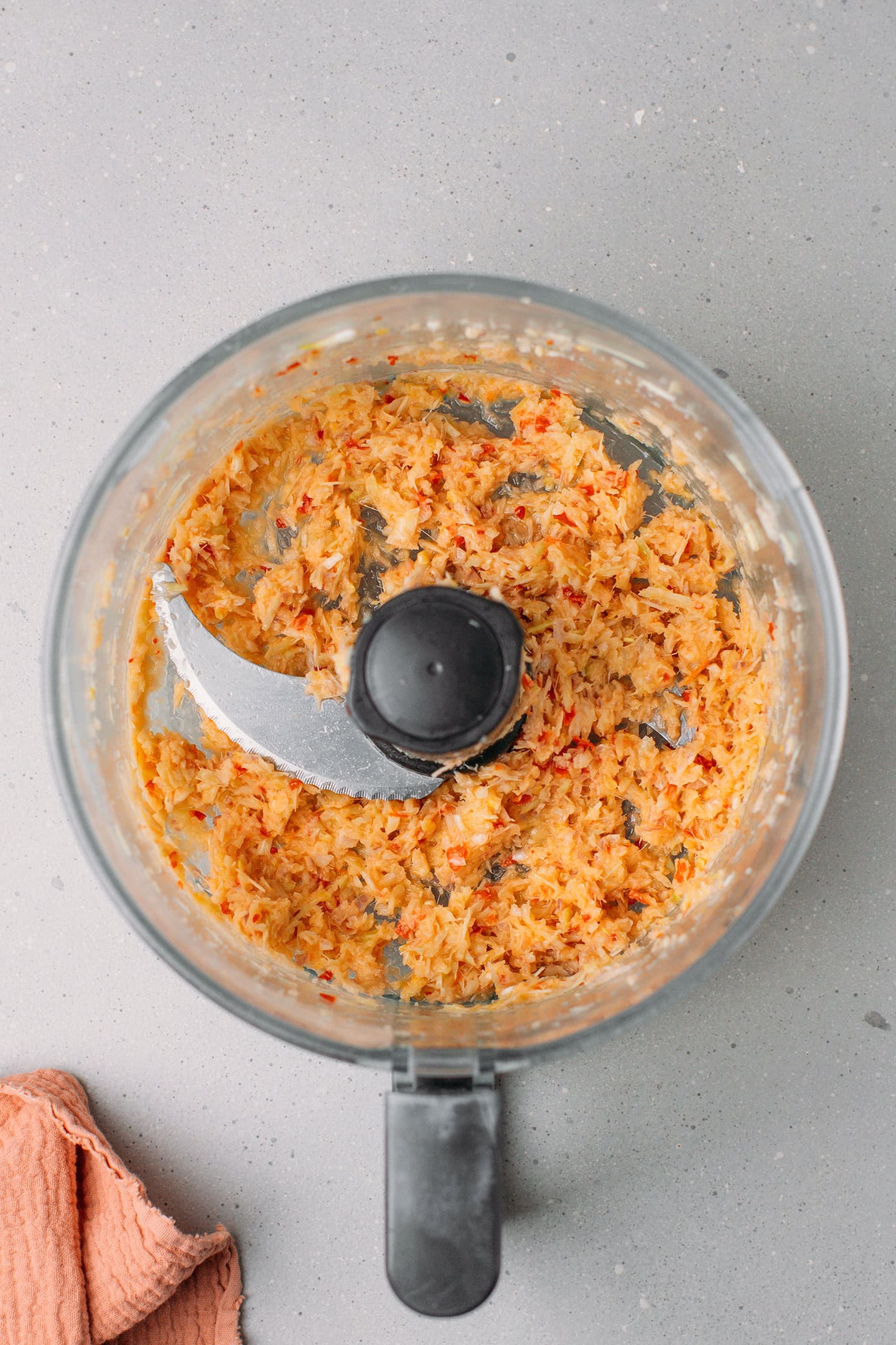Finely chopped lemongrass, garlic, and shallots in a food processor.