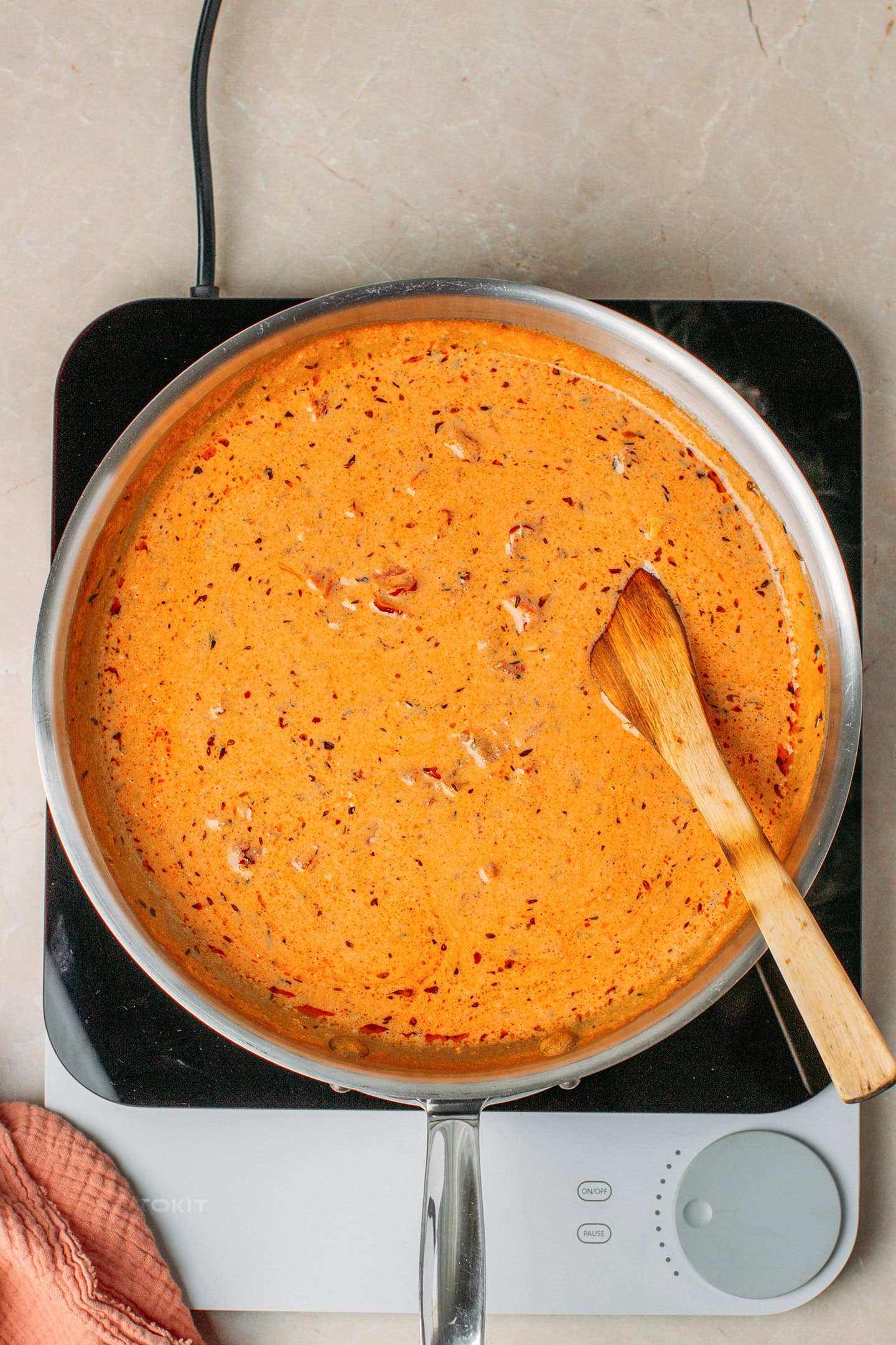 Sun-dried tomato sauce in a skillet.