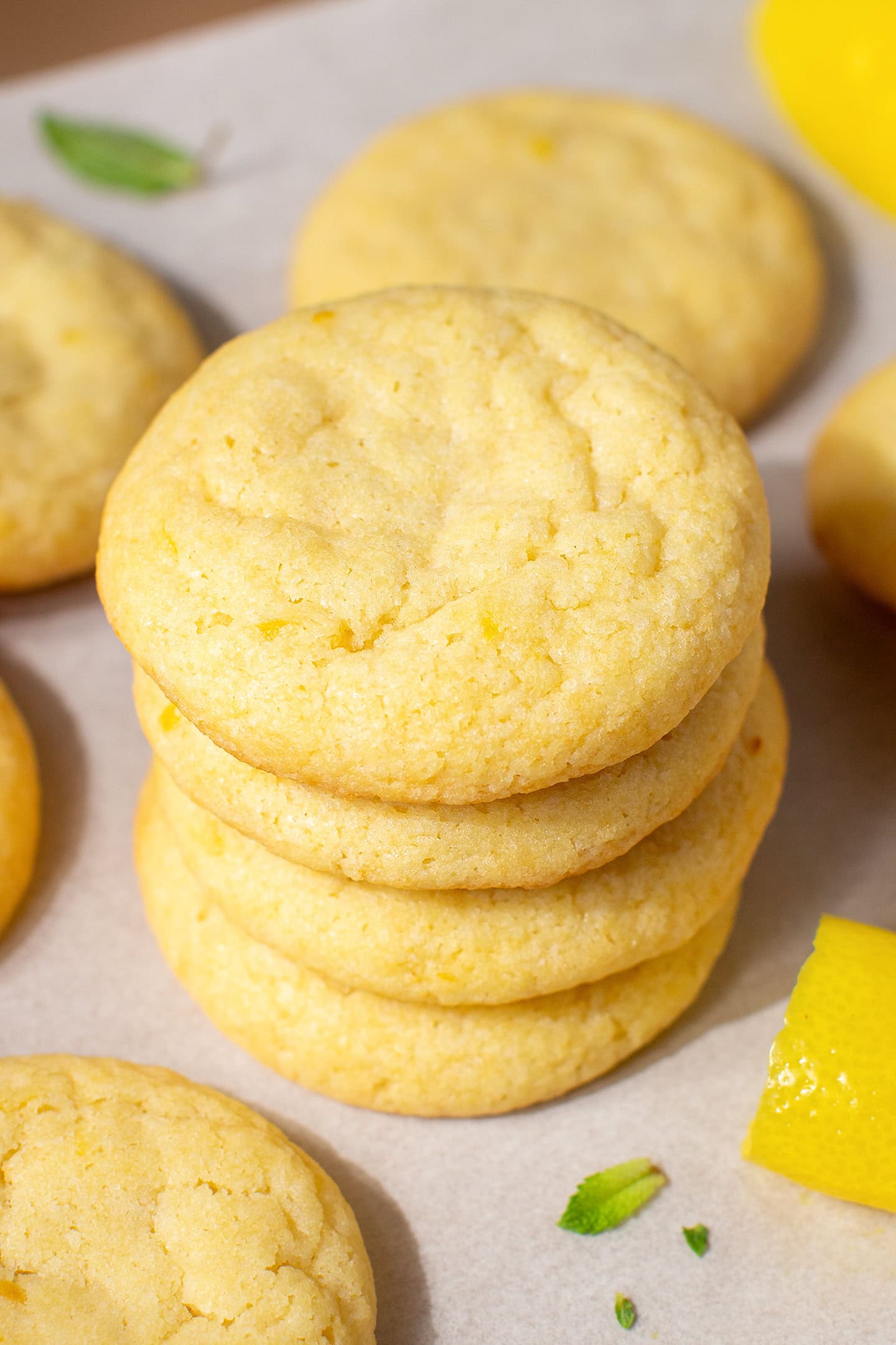 Four lemon cookies stacked.