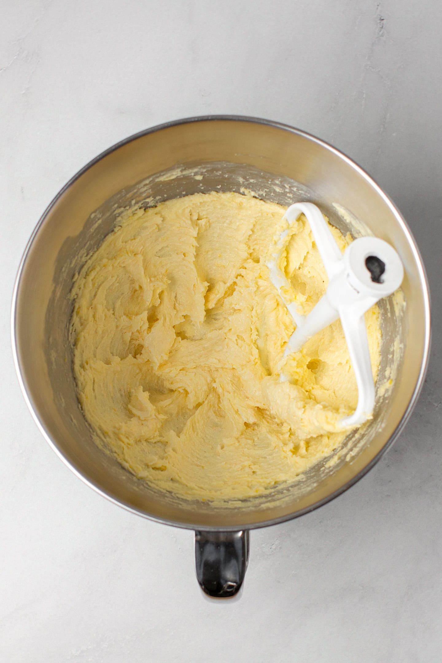 Creamed butter in a stand mixer.