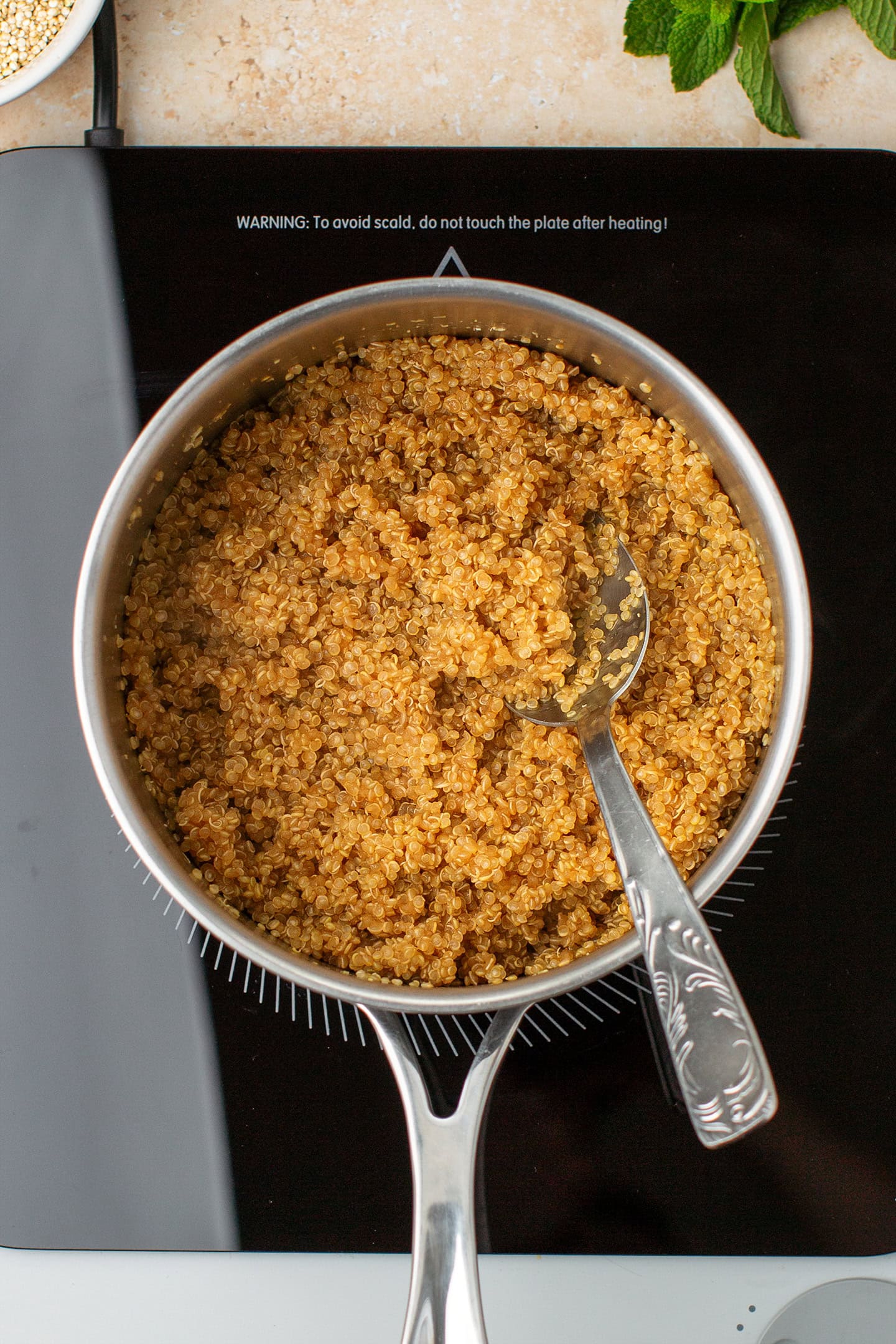 Cooked quinoa in a saucepan.