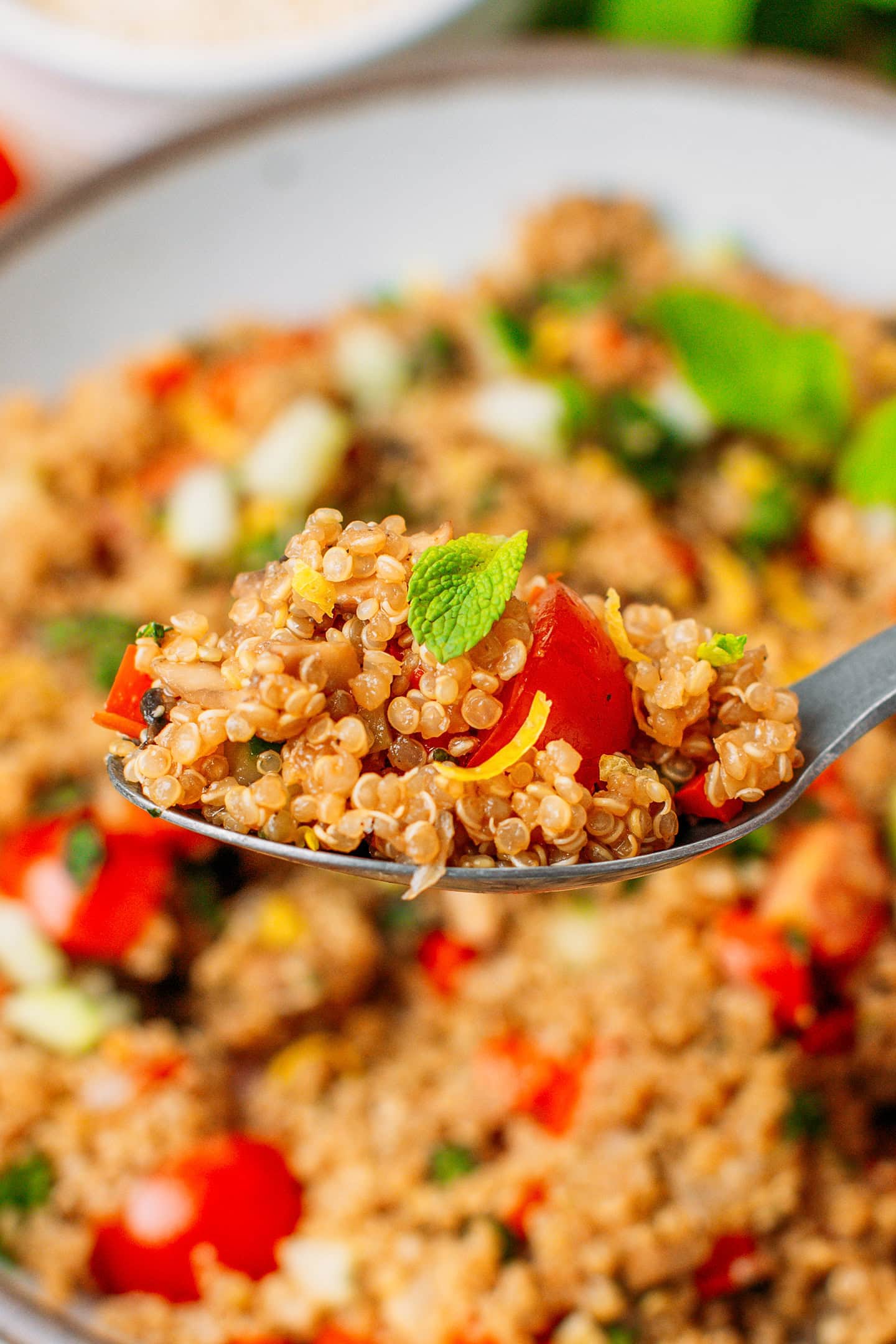 Close-up of quinoa salad with cherry tomatoes and preserved lemon.