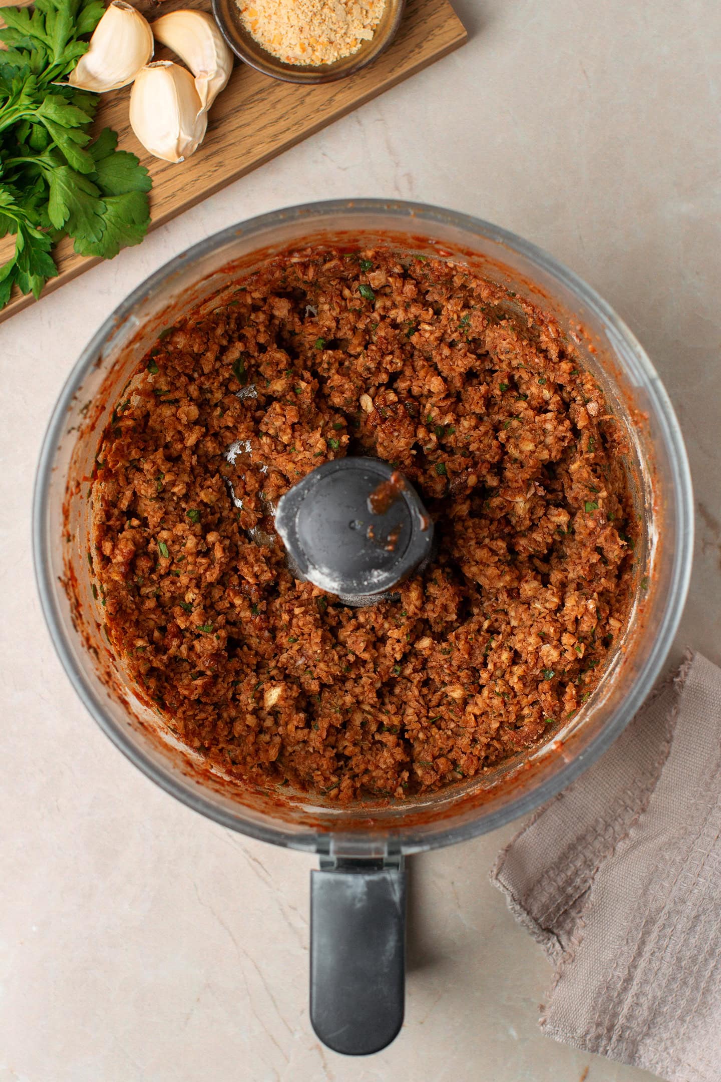 Vegan ground meat in a food processor.