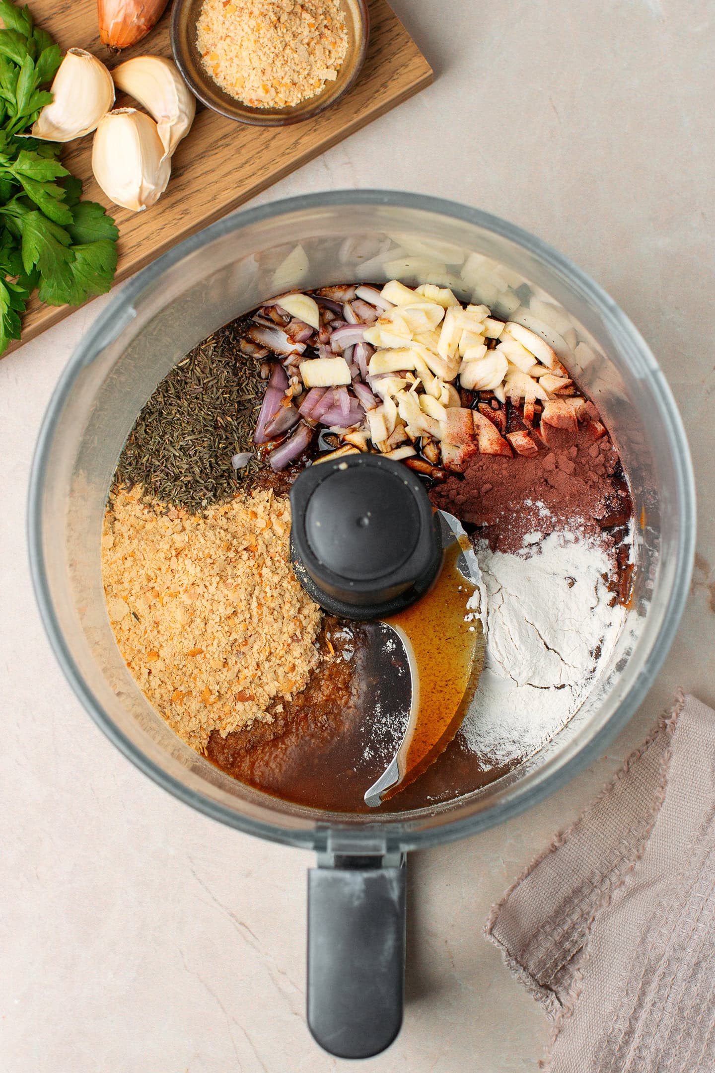 Garlic, shallots, thyme, nutritional yeast, and onion powder in a food processor.