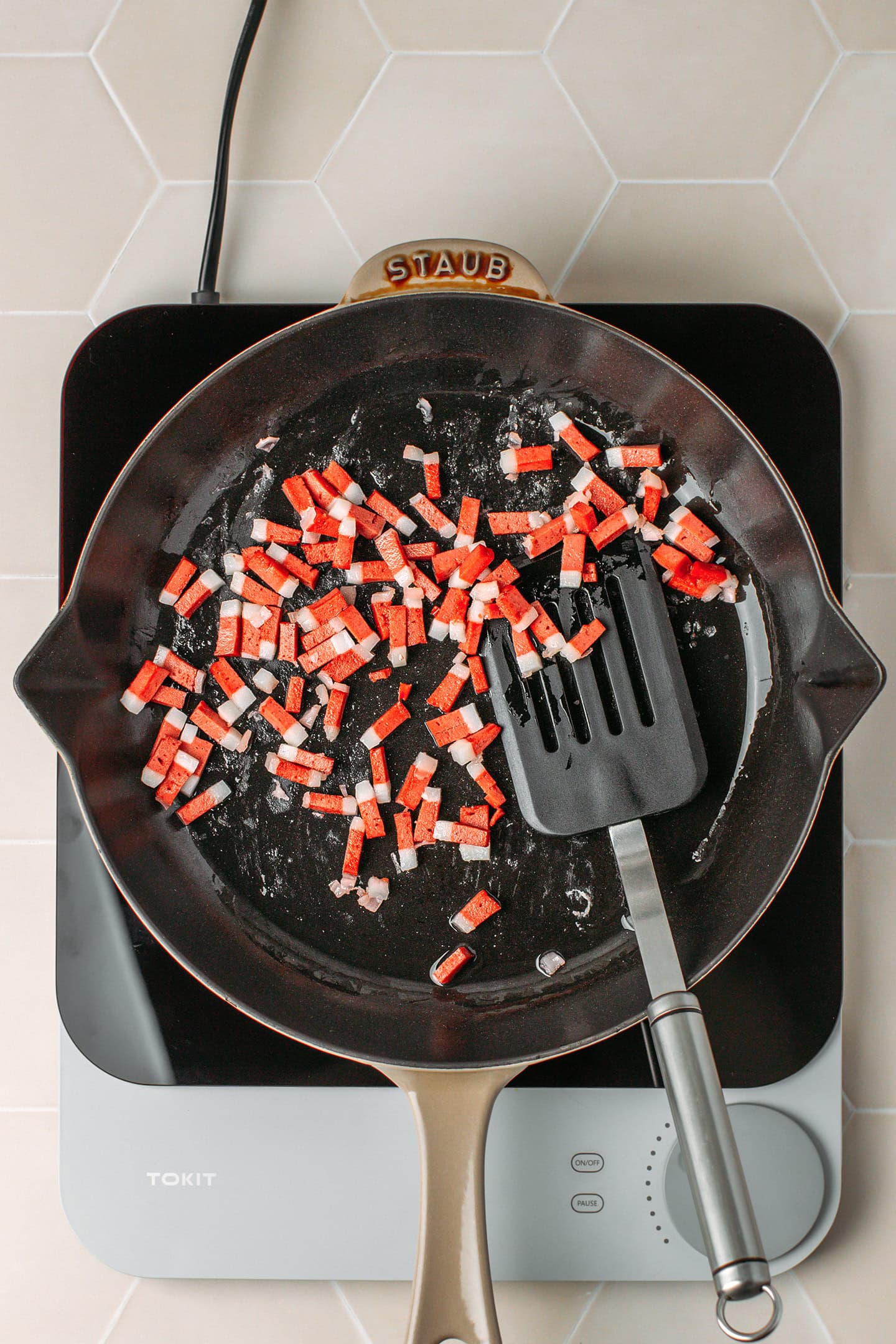Saut&eacute;ed vegan bacon bits in a skillet.