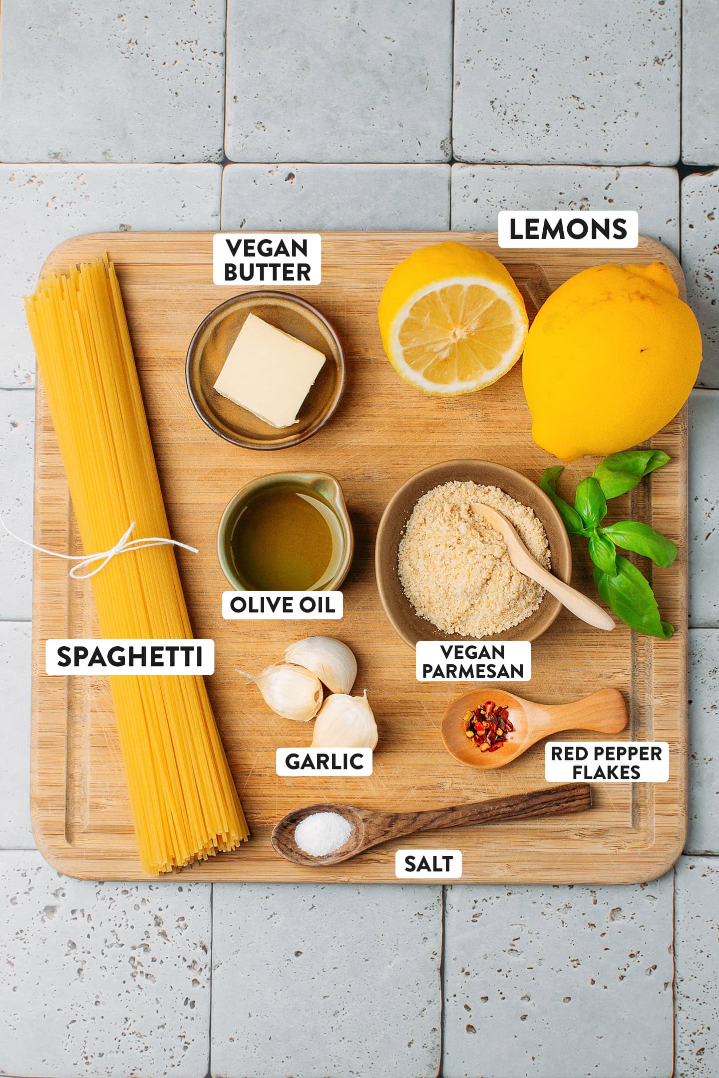 Ingredients like spaghetti, vegan butter, lemon, olive oil, garlic, and vegan parmesan.