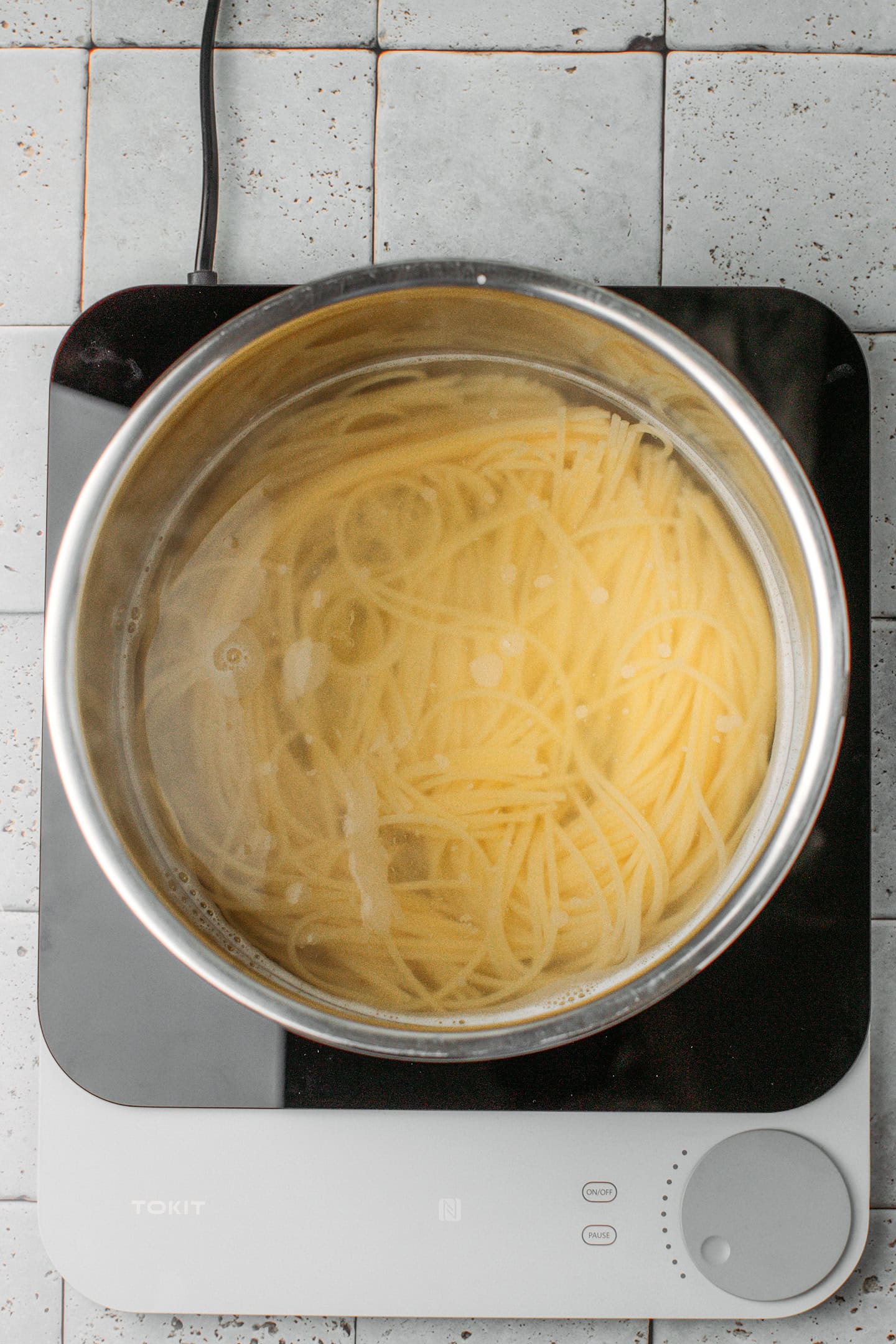 Cooked spaghetti in a large pot.