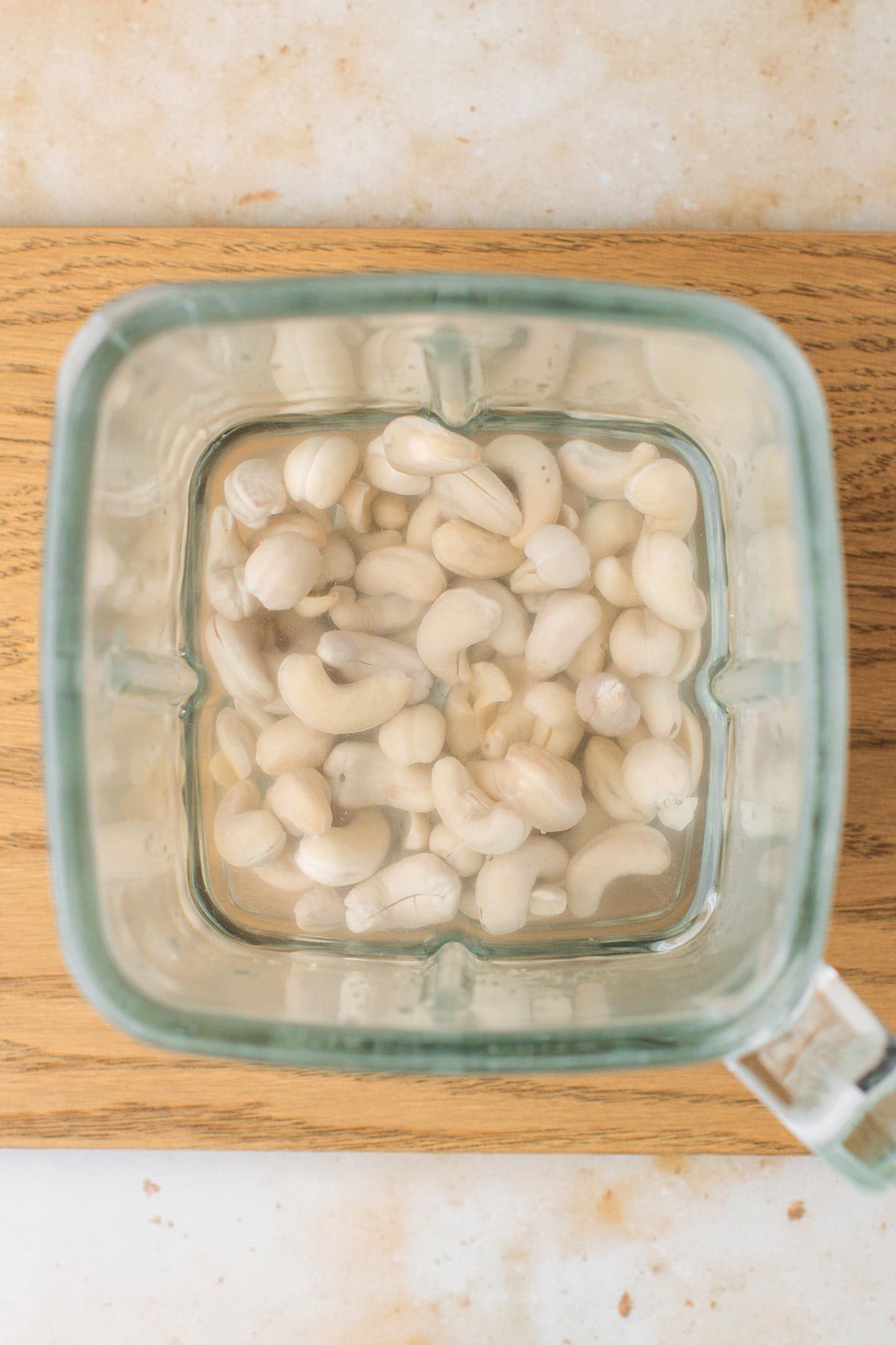 Raw cashews and water in a blender.
