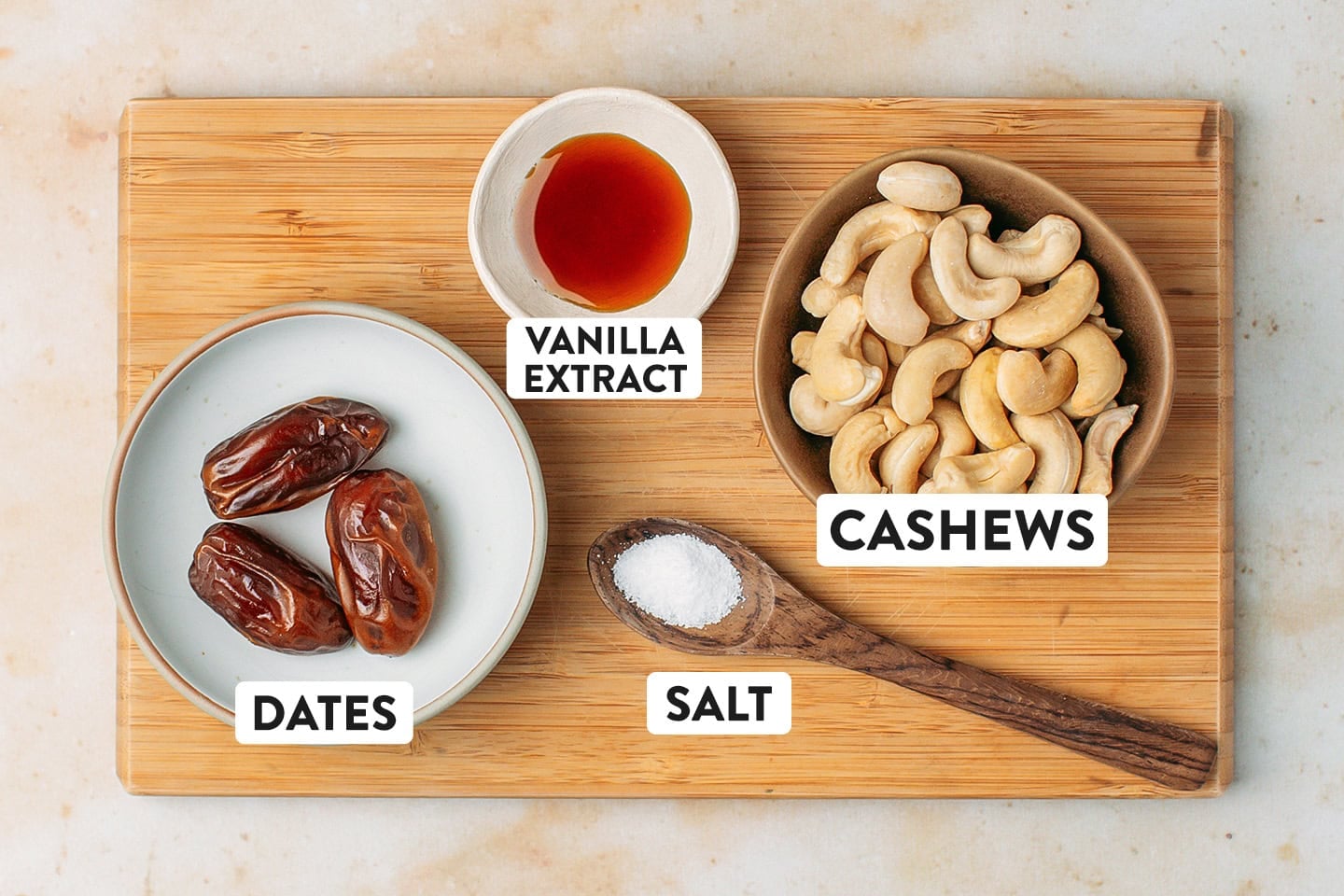 Ingredients like dates, cashews, vanilla extract, and salt.