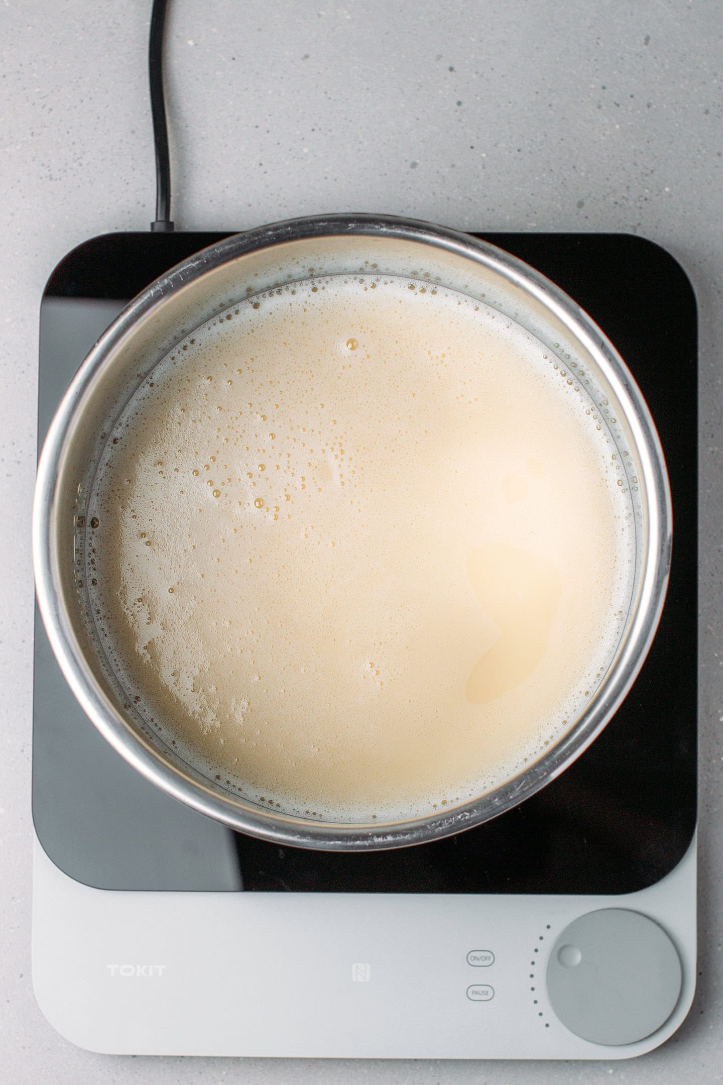 Fava bean milk in a large pot.
