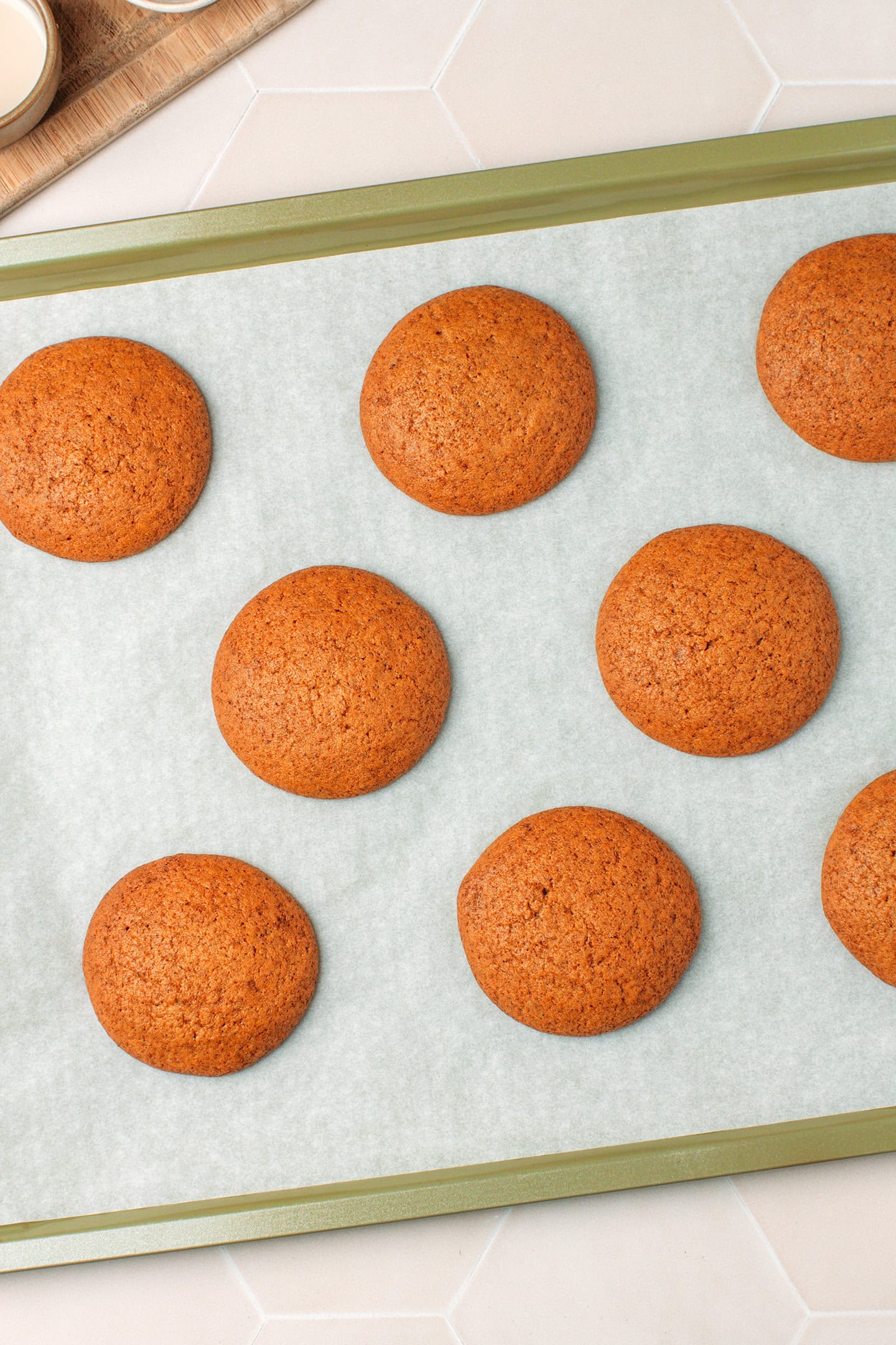 Baked pumpkin cakes on a baking sheet.
